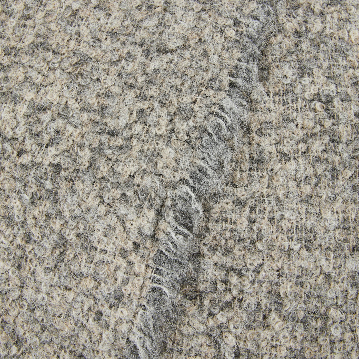 Close-up of Lanerossi Bogotà throw's boucle weave texture in silver grey.