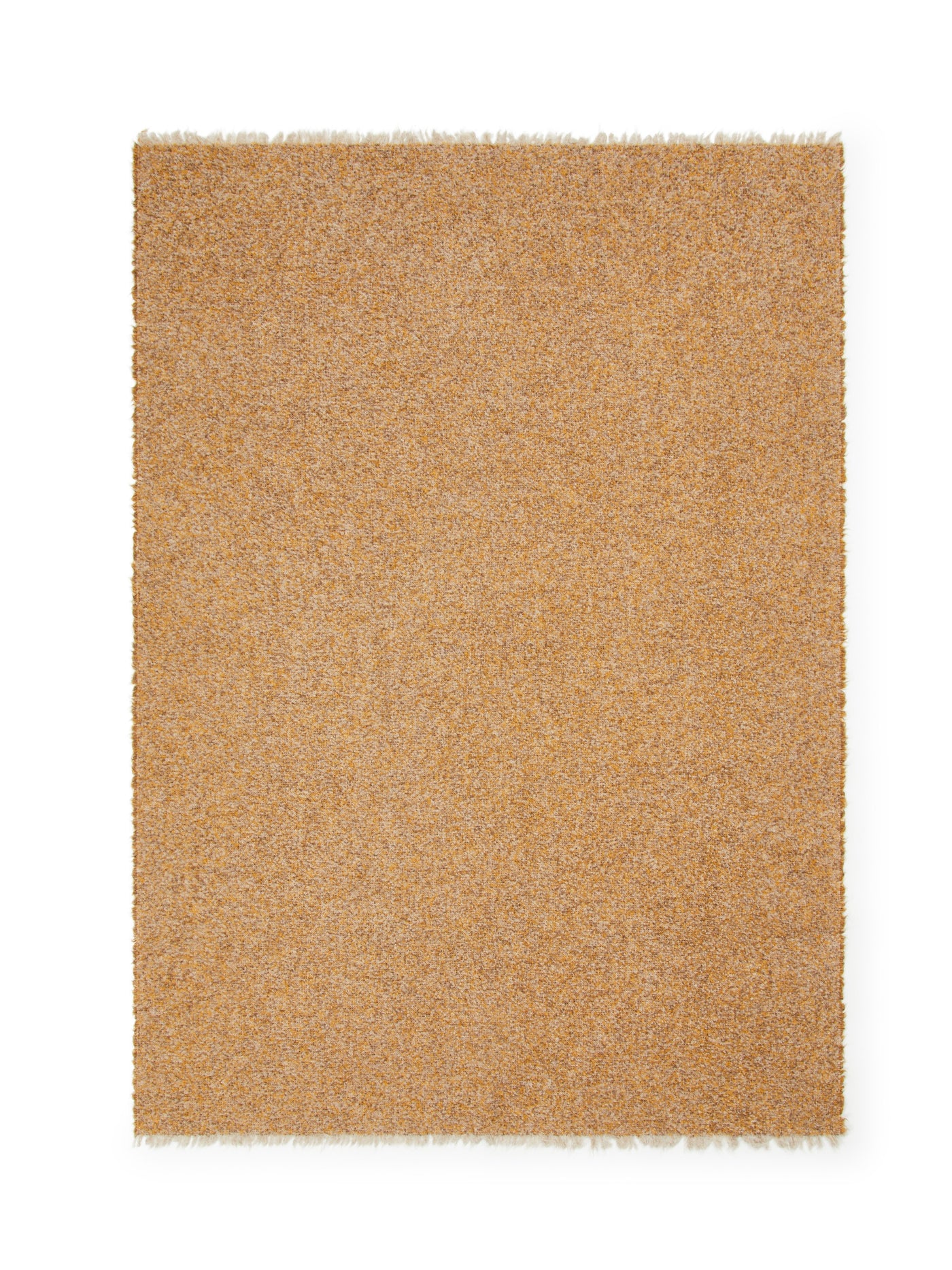 Fringed edge detail of Lanerossi Bogotà throw in golden amber boucle texture.