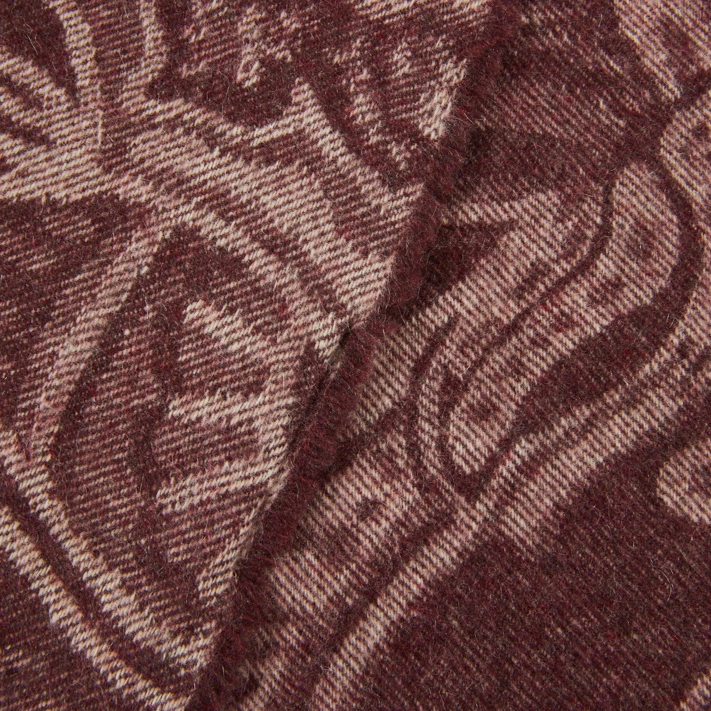 Close-up of Lanerossi Bohémien throw in burgundy, showing woven floral jacquard texture.