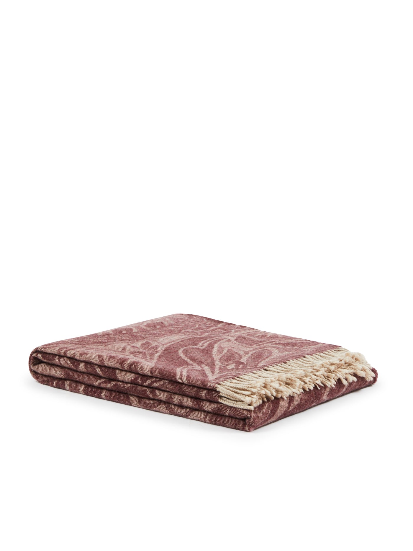 Lanerossi Bohémien throw folded, dusty rose botanical jacquard pattern with cream fringe trim.