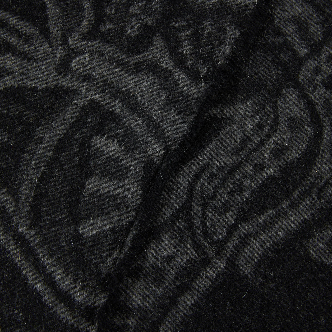 Close-up of Lanerossi Bohémien throw in charcoal, showing tonal paisley jacquard weave.