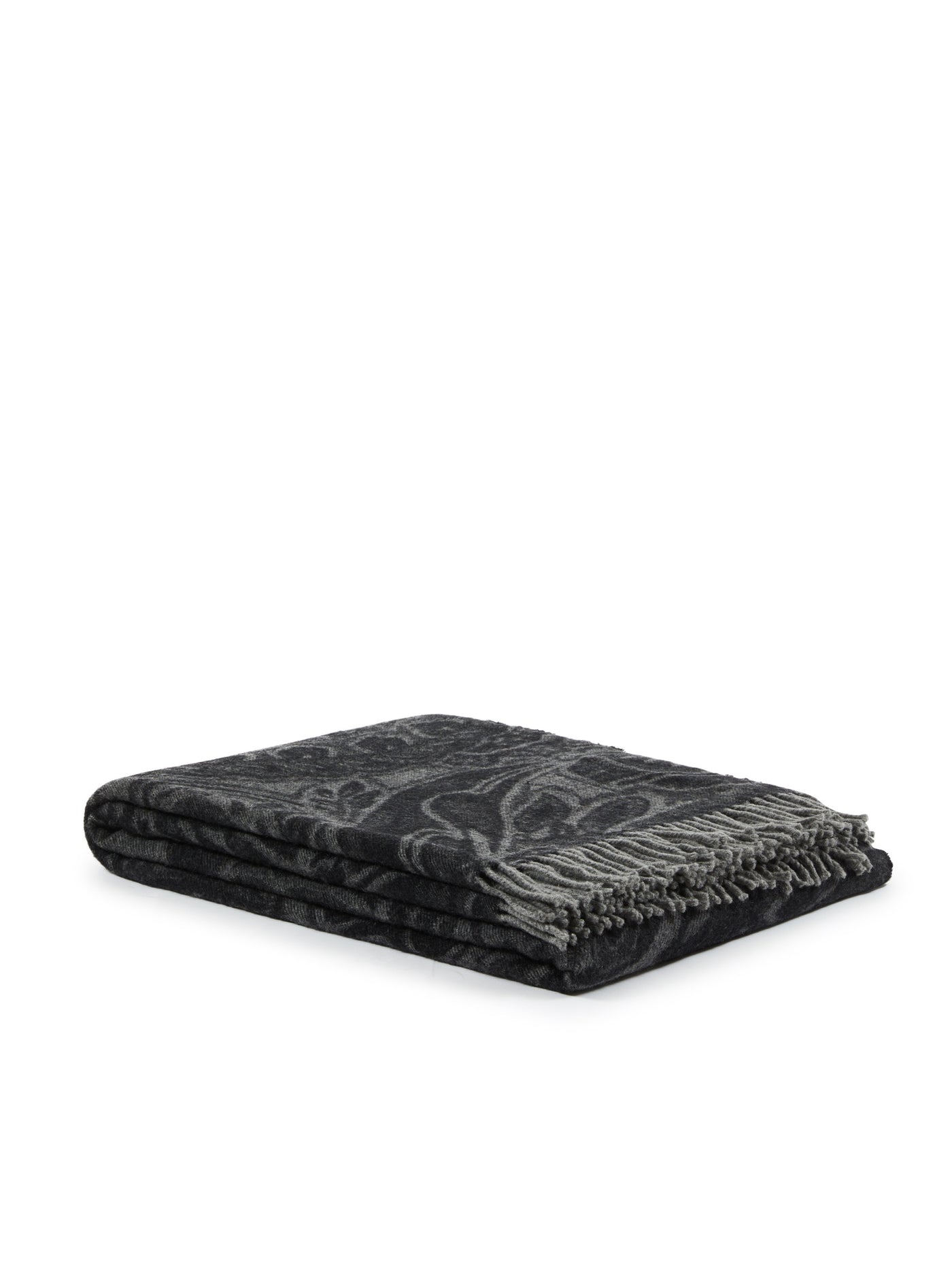 Folded charcoal throw with tonal jacquard pattern and fringe trim, angled view.
