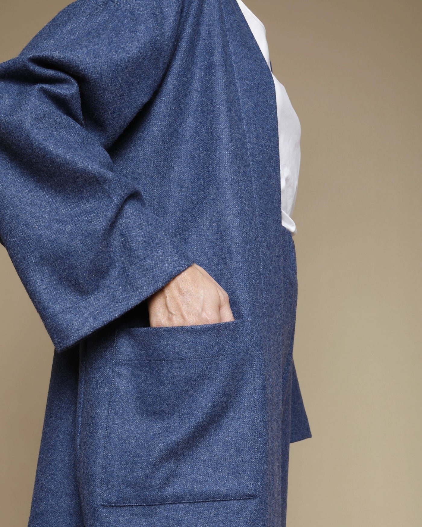 Lanerossi Extrafine Merino oversized cardigan in navy, pocket detail with hand resting inside.