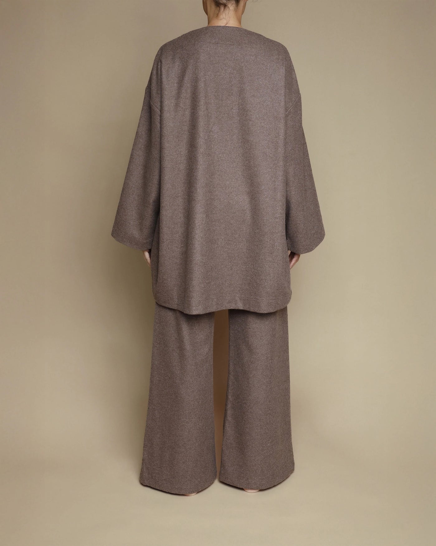 Back view of Lanerossi oversized merino cardigan and wide-leg pants in taupe melange.