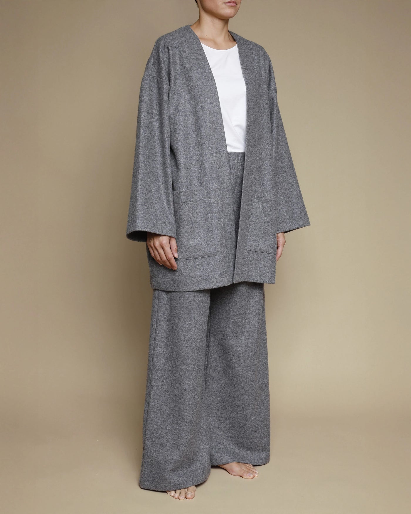 Model wearing Lanerossi grey merino oversized cardigan with wide-leg trousers, front-open style.