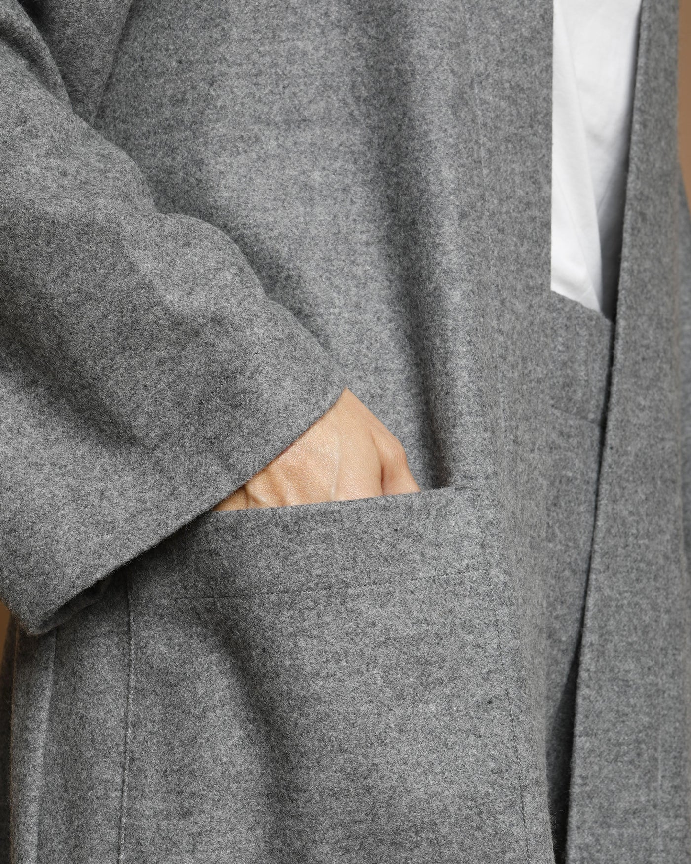 Close-up of Lanerossi Extrafine Merino Cardigan pocket detail in heather grey.