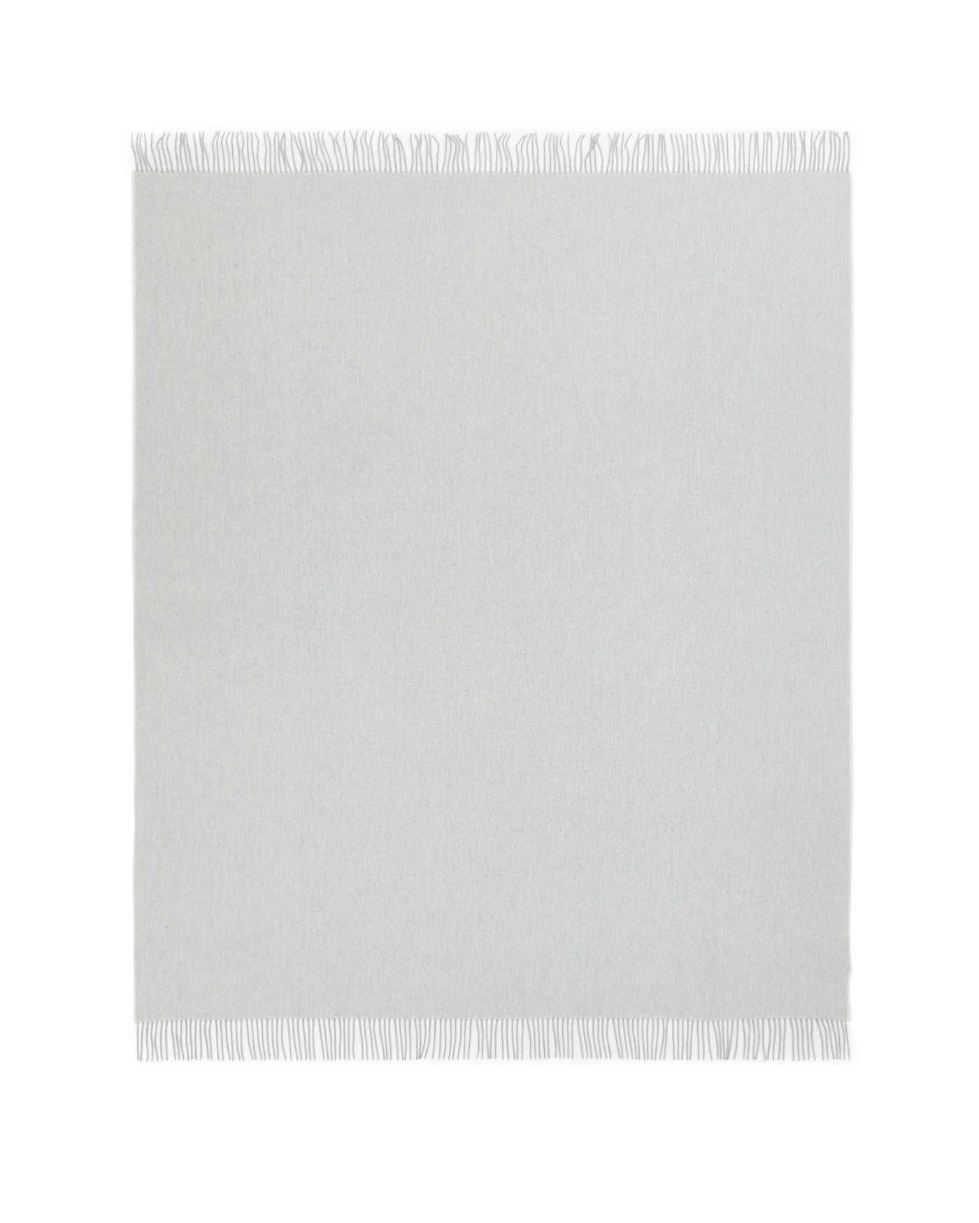 Ivory woven throw with short fringe trim along top and bottom edges.