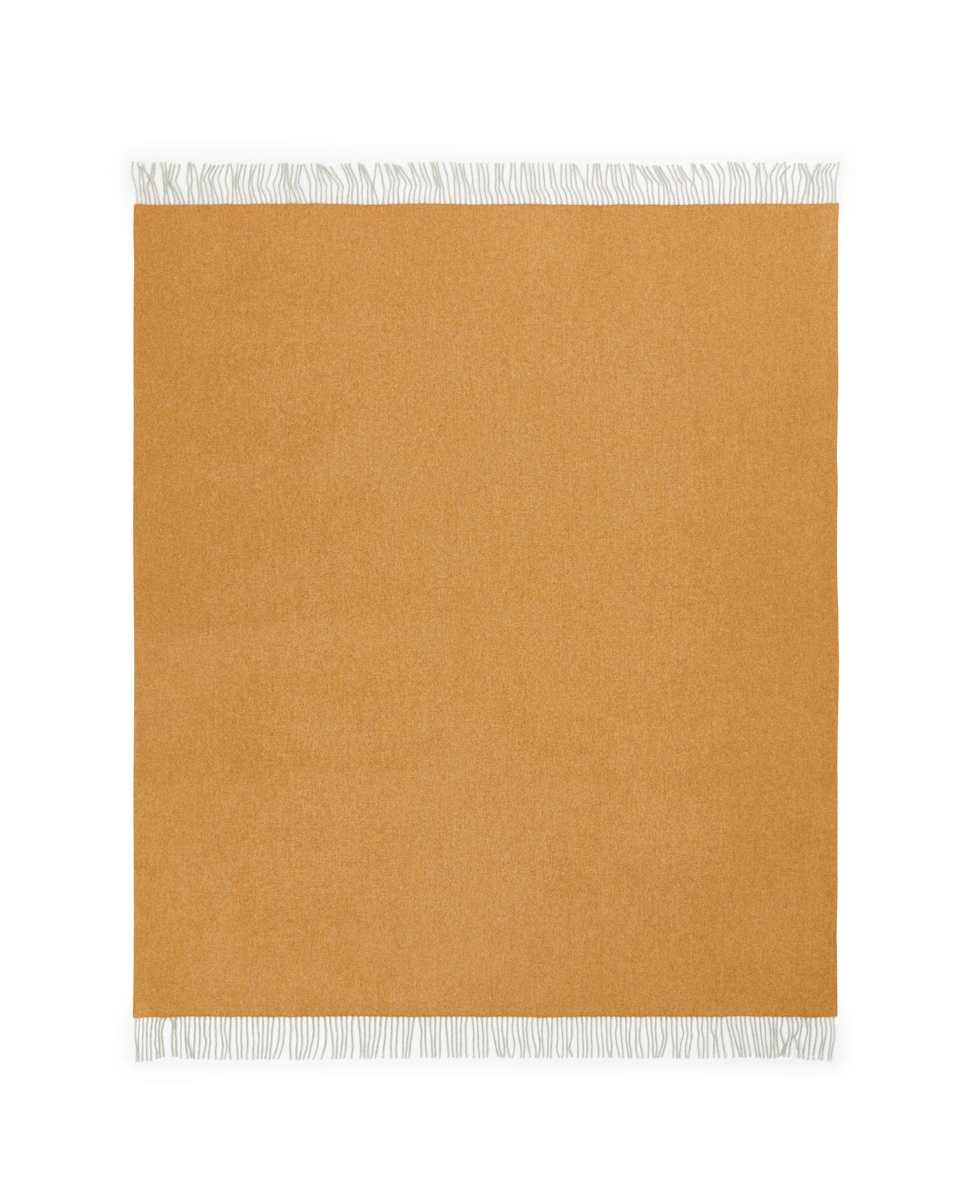 Lanerossi Cassiopea throw in amber, flat lay showing ivory fringe trim detail.