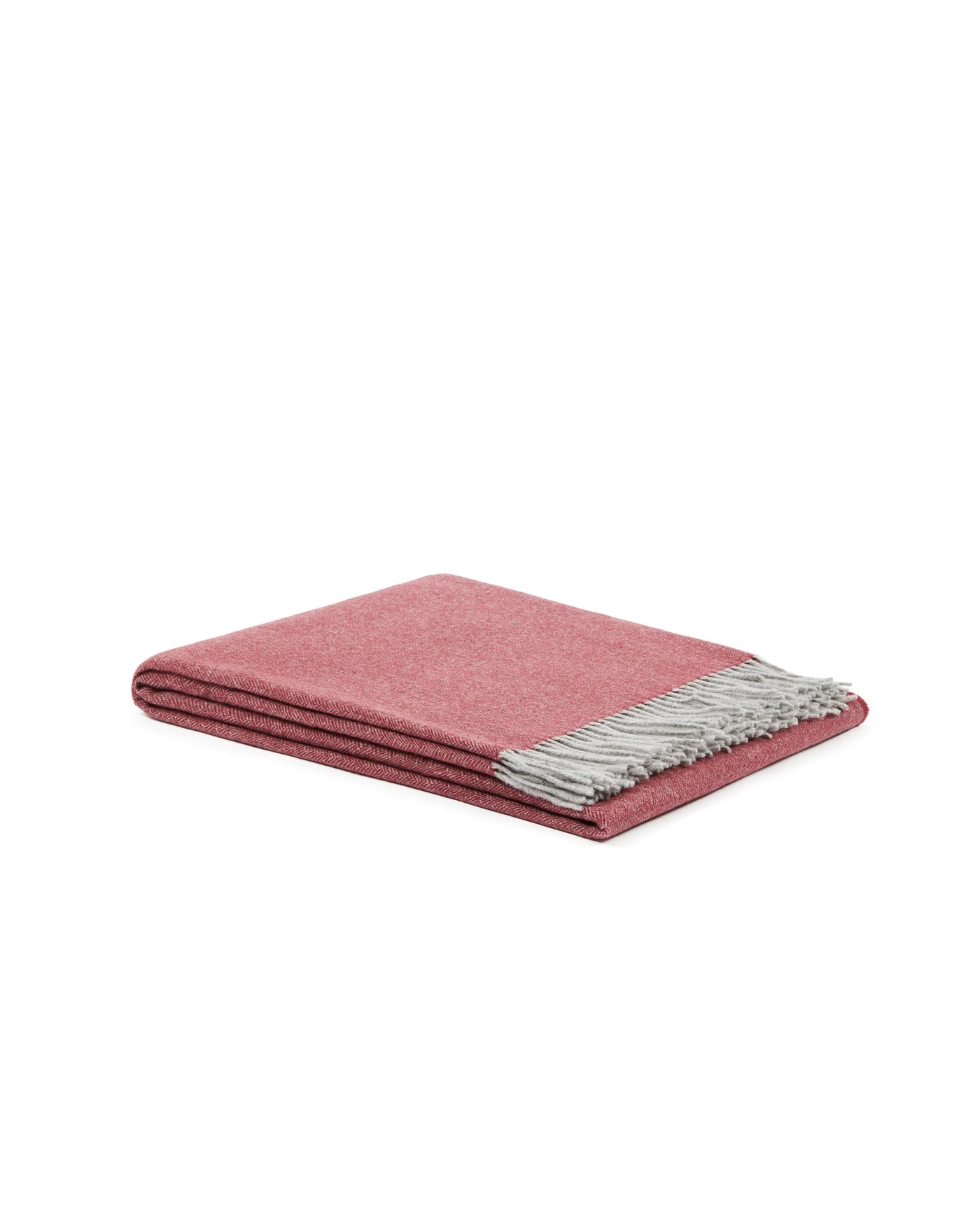 Lanerossi Cassiopea throw folded, rose herringbone weave with silver grey fringe detail.