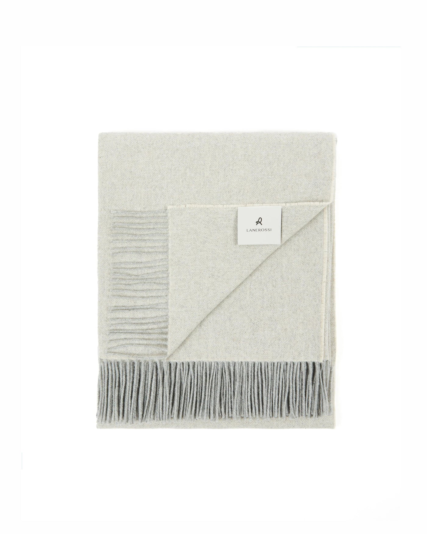 Lanerossi Cassiopea throw folded flat, ivory and grey fringe detail visible.