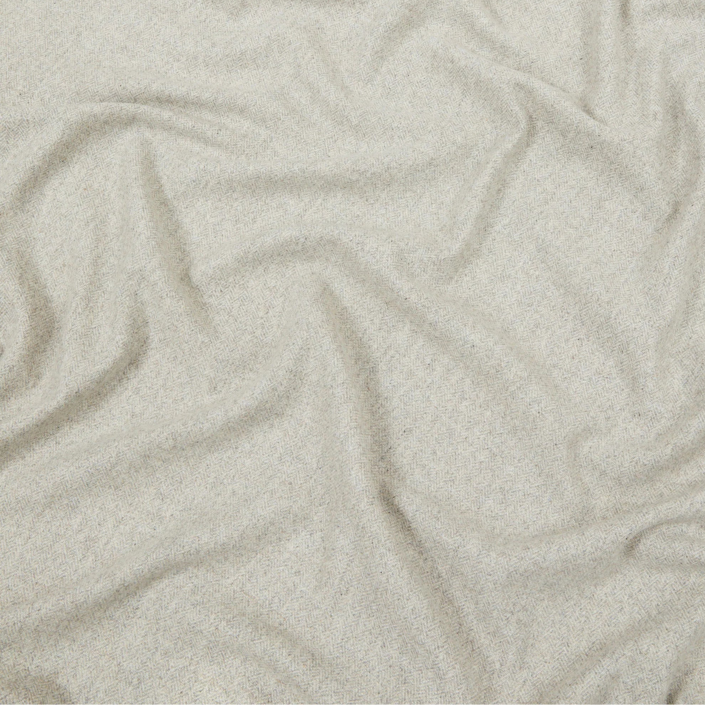 Close-up of draped ivory Lanerossi Cassiopea throw, showing soft heathered wool texture.