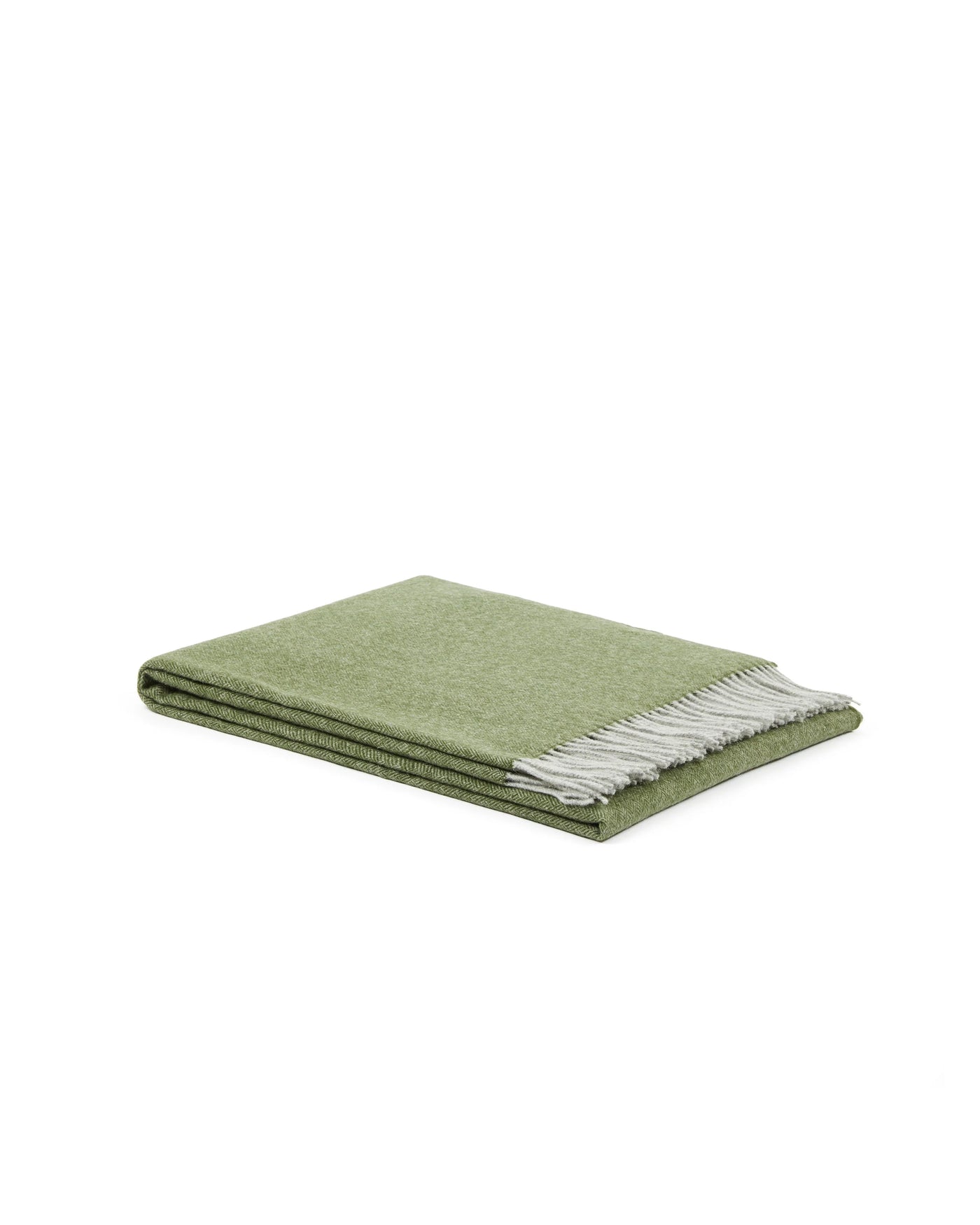 Cassiopea throw folded flat, sage green with contrast ivory fringe trim.