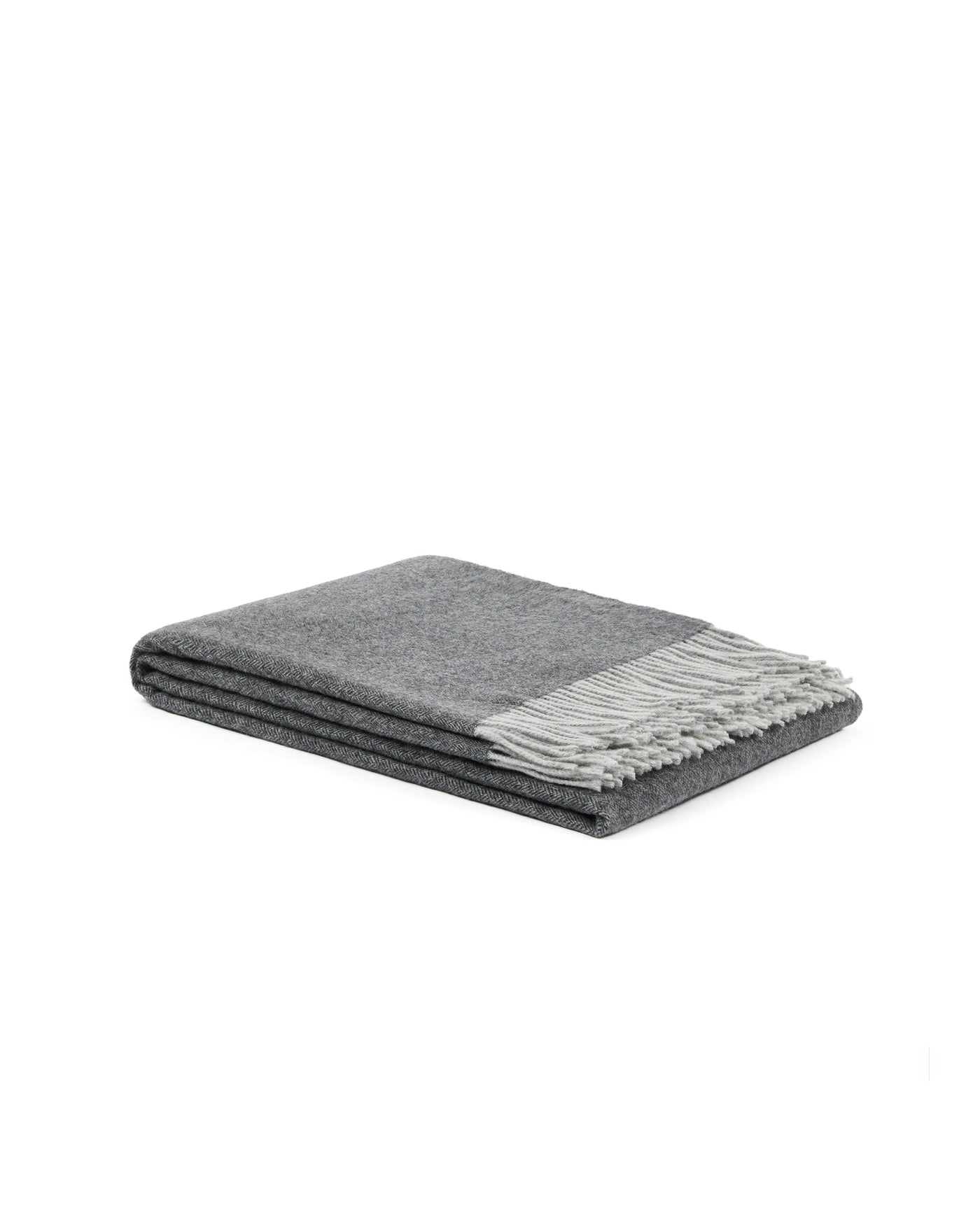 Lanerossi Cassiopea throw folded flat, charcoal wool with light grey fringe trim.