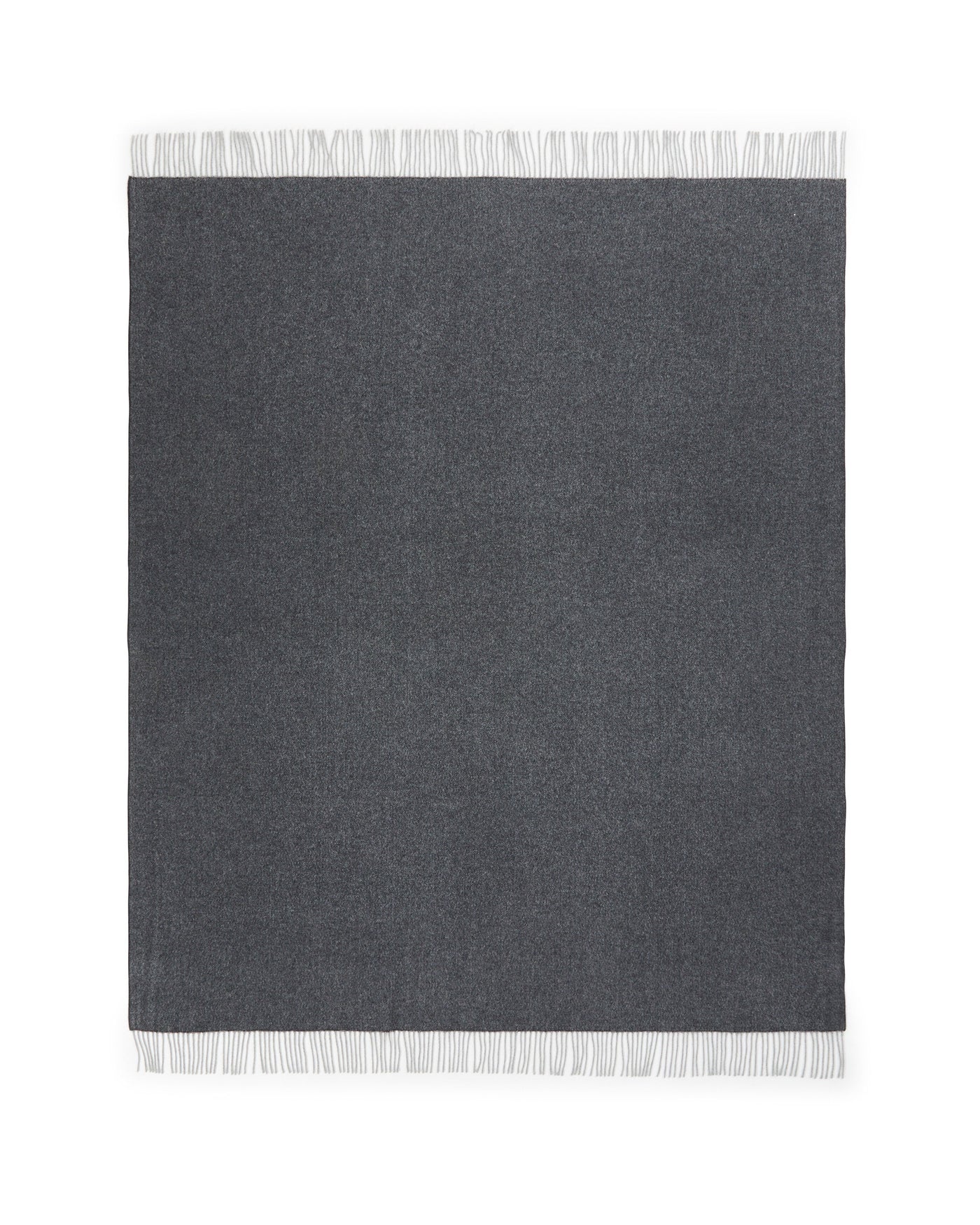 Lanerossi Cassiopea throw in charcoal, flat lay showing white fringe trim detail.