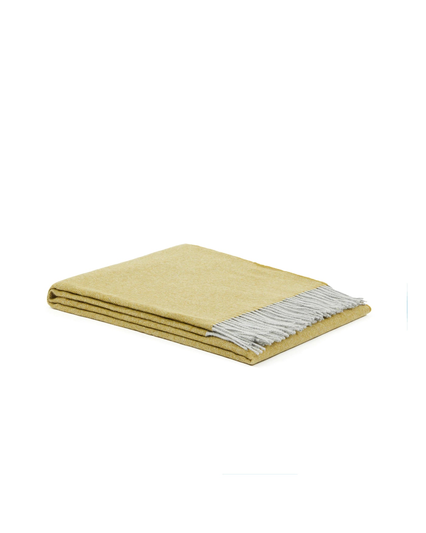 Folded citron wool throw with contrast grey fringe, angled view.