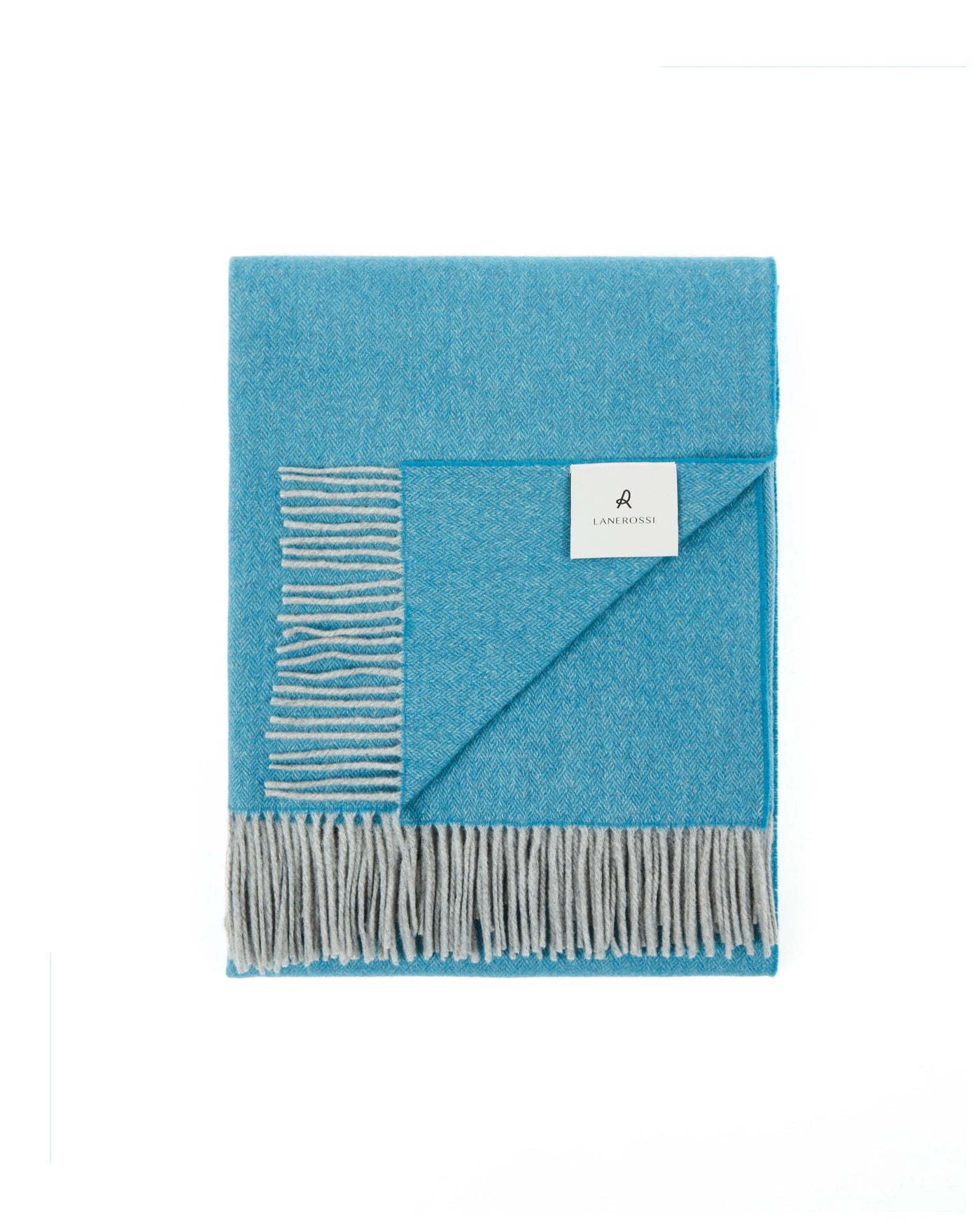 Lanerossi Cassiopea throw folded, aqua blue with grey fringe and striped reverse detail.