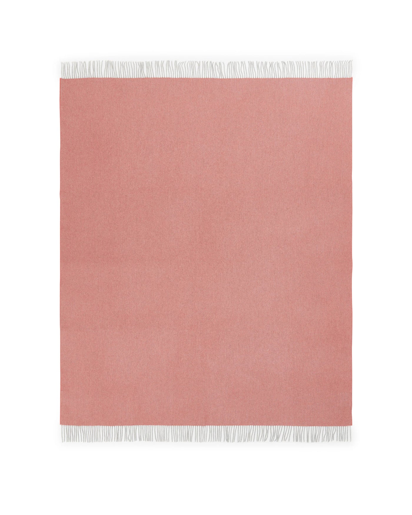 Lanerossi Cassiopea throw in blush with white fringe trim, flat lay view.