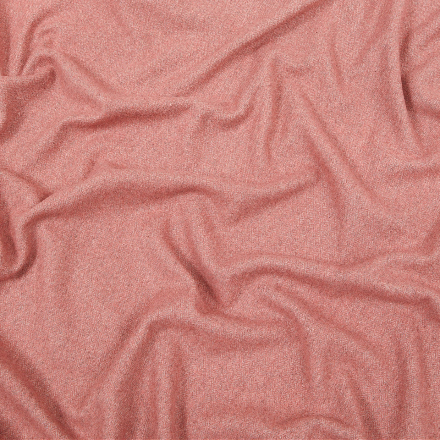 Lanerossi Cassiopea throw in rose, close-up of draped wool fabric texture.