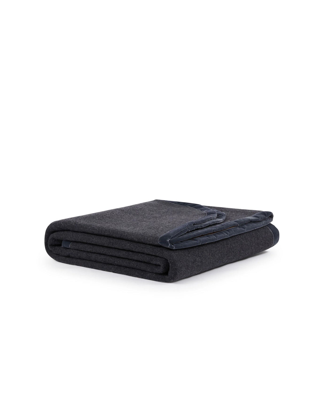 Charcoal wool blanket folded neatly, showing navy trim detail along the edge.