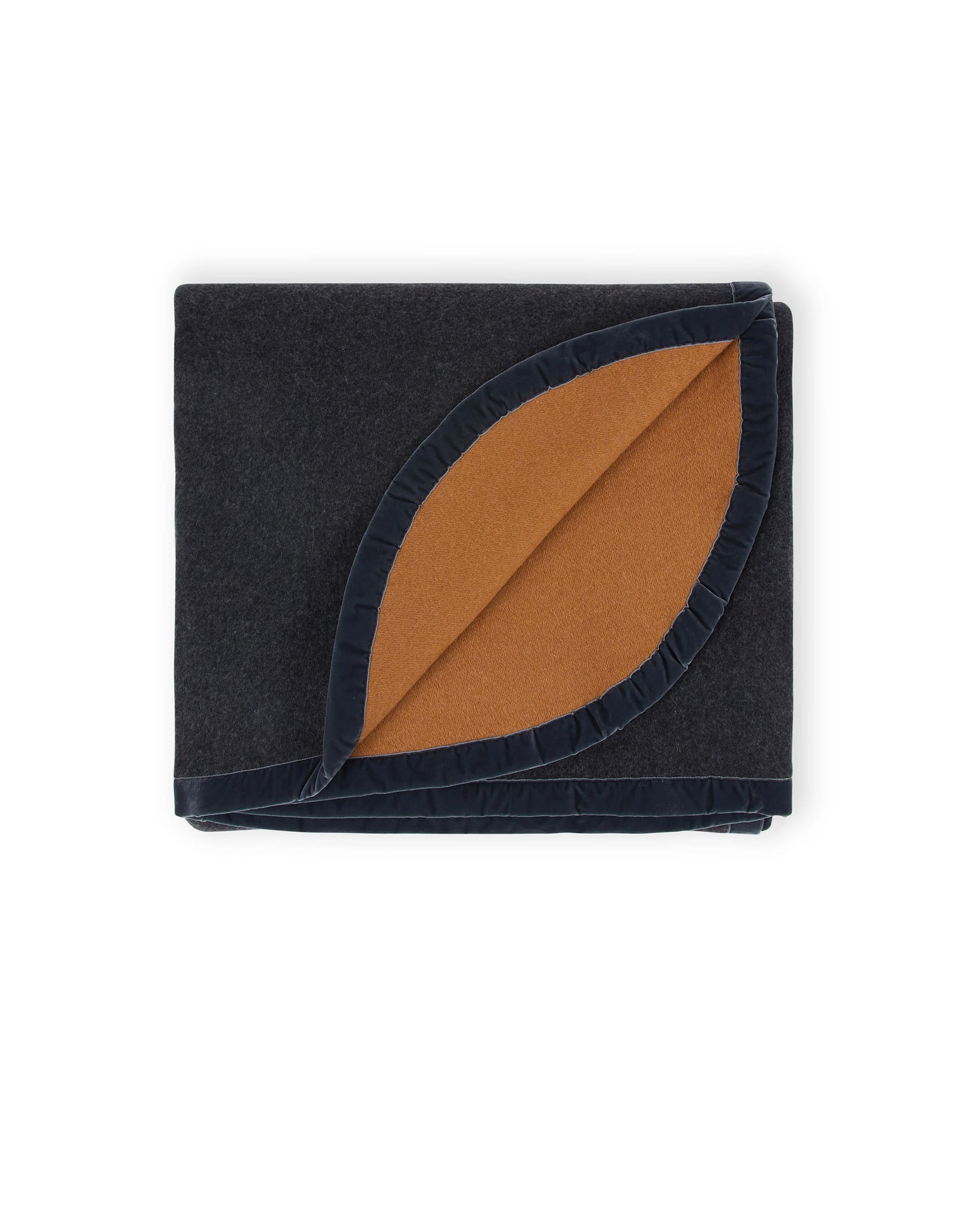 Folded navy wool blanket with cognac reverse and ruffled edge trim detail.