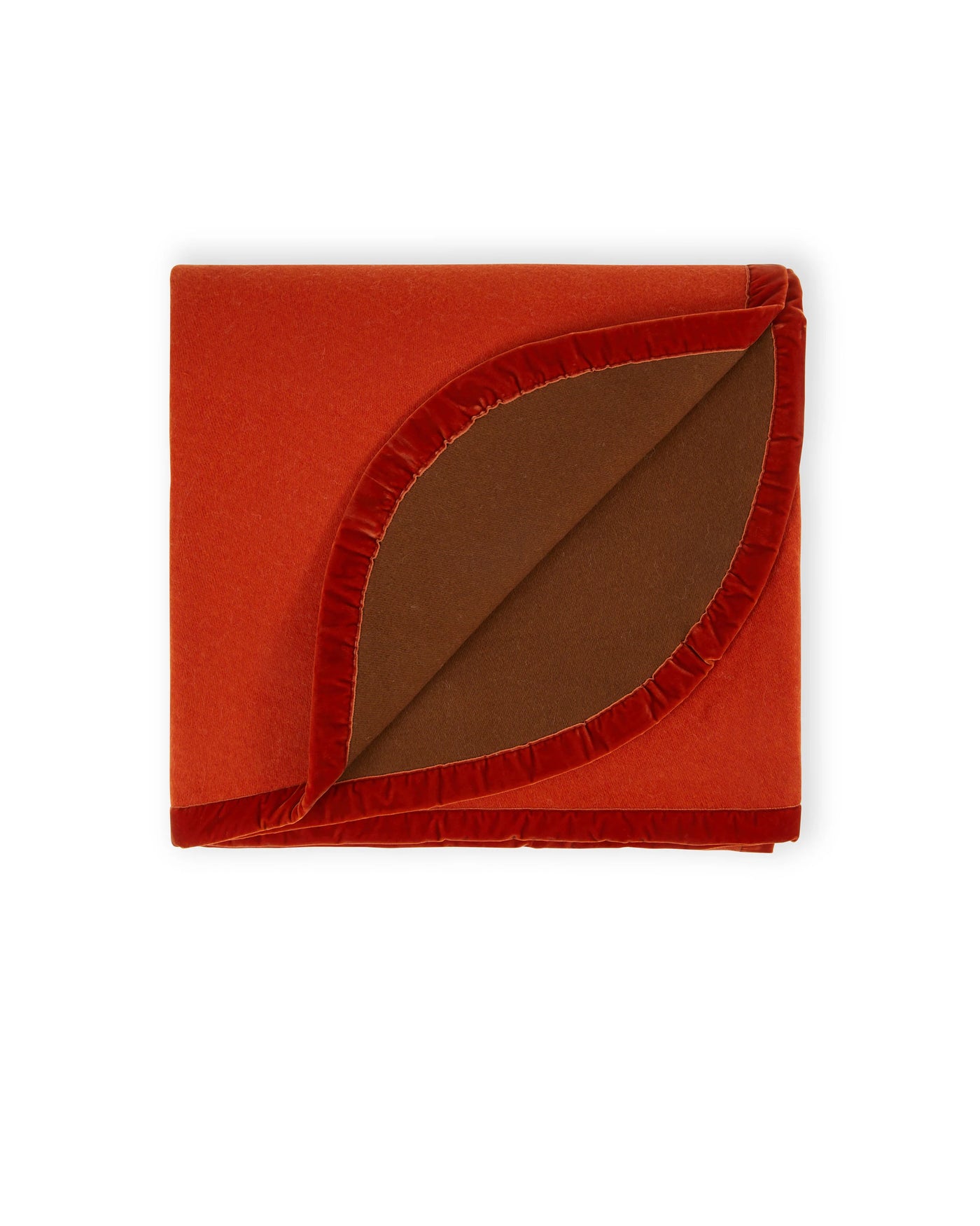 Corner fold detail revealing cognac reverse on Lanerossi Color thermo blanket in burnt orange.