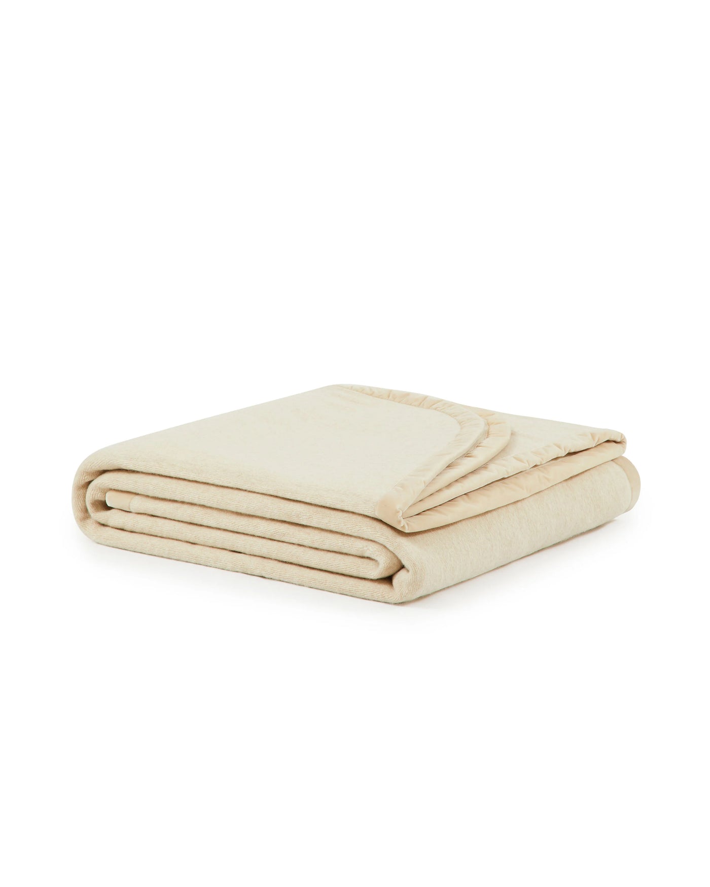 Lanerossi Thermo Blanket folded, ivory with blanket-stitched trim detail.