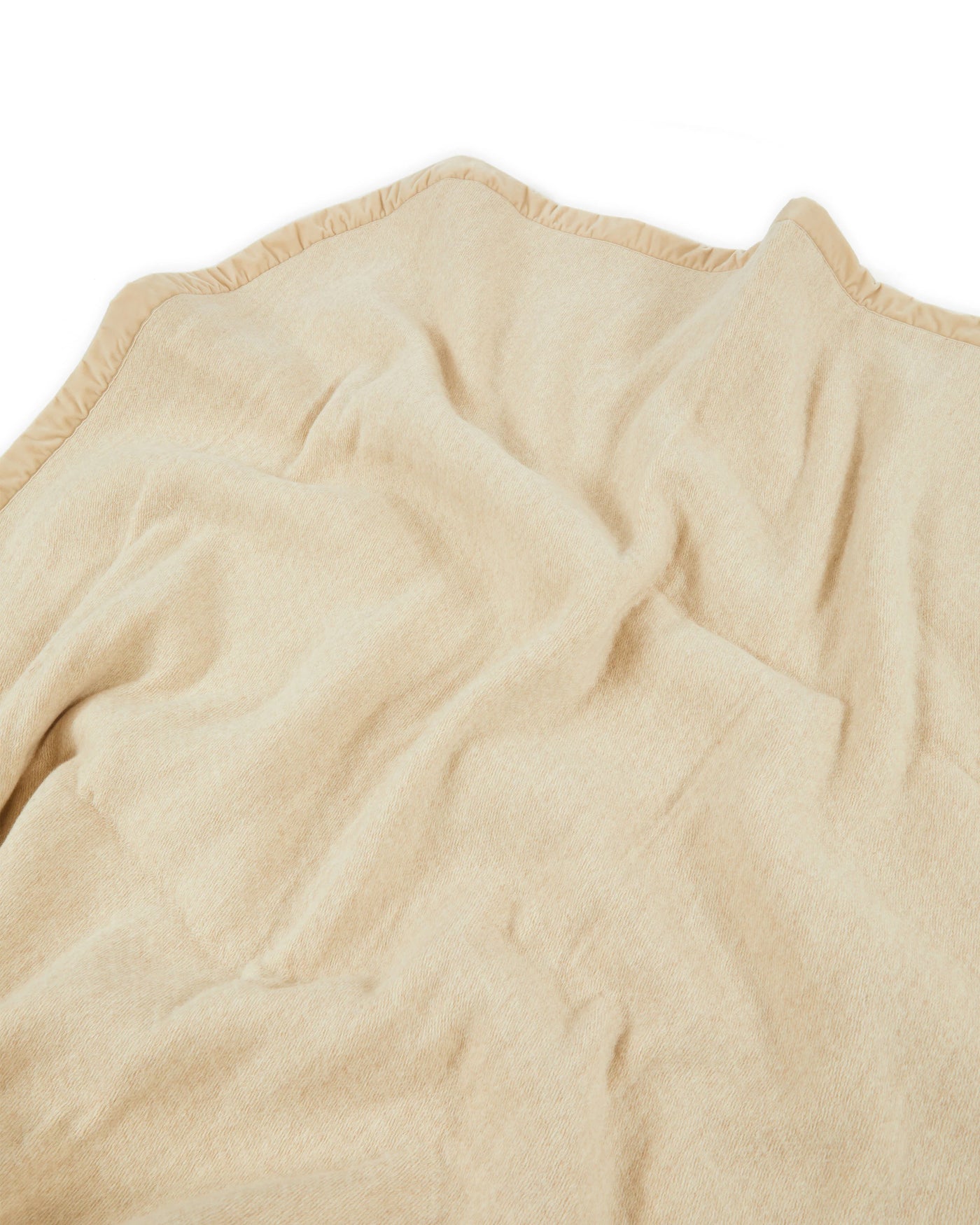 Close-up of Lanerossi Thermo Blanket in ivory with blanket-stitched edge detail.