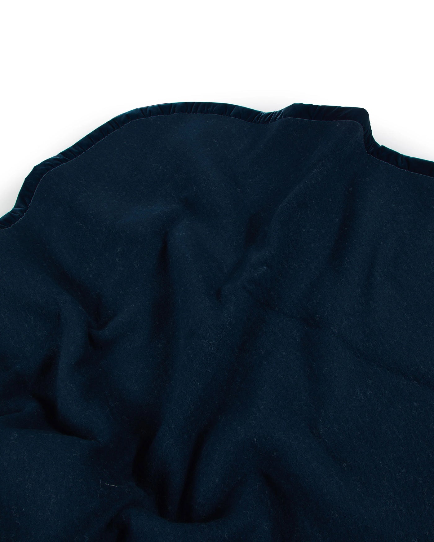 Close-up of Lanerossi Thermo Blanket in navy, showing scalloped edge trim detail.