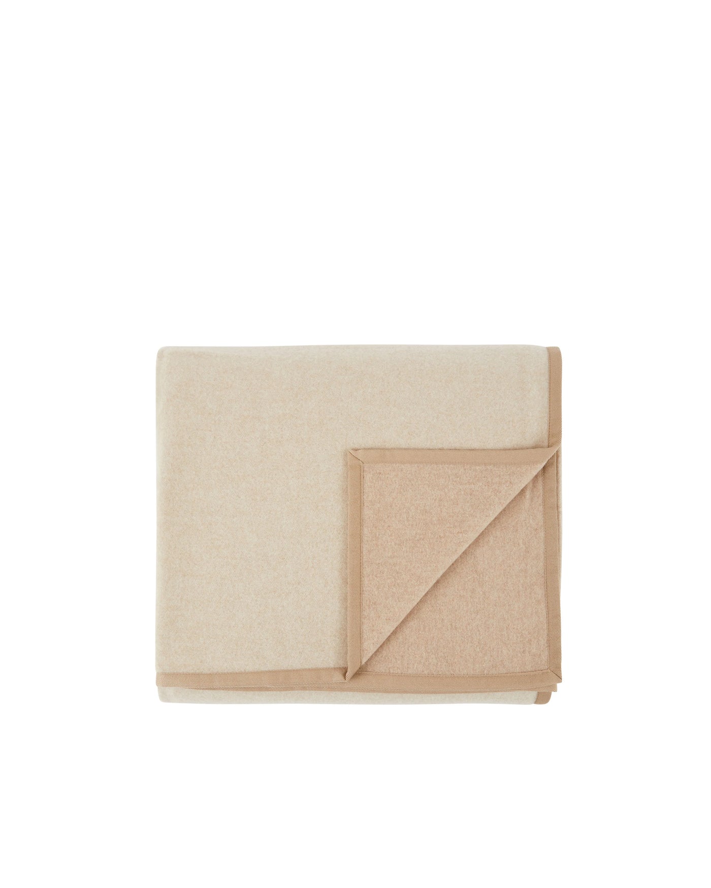 Folded ivory wool blanket with camel border trim, corner turned back to reveal reverse.