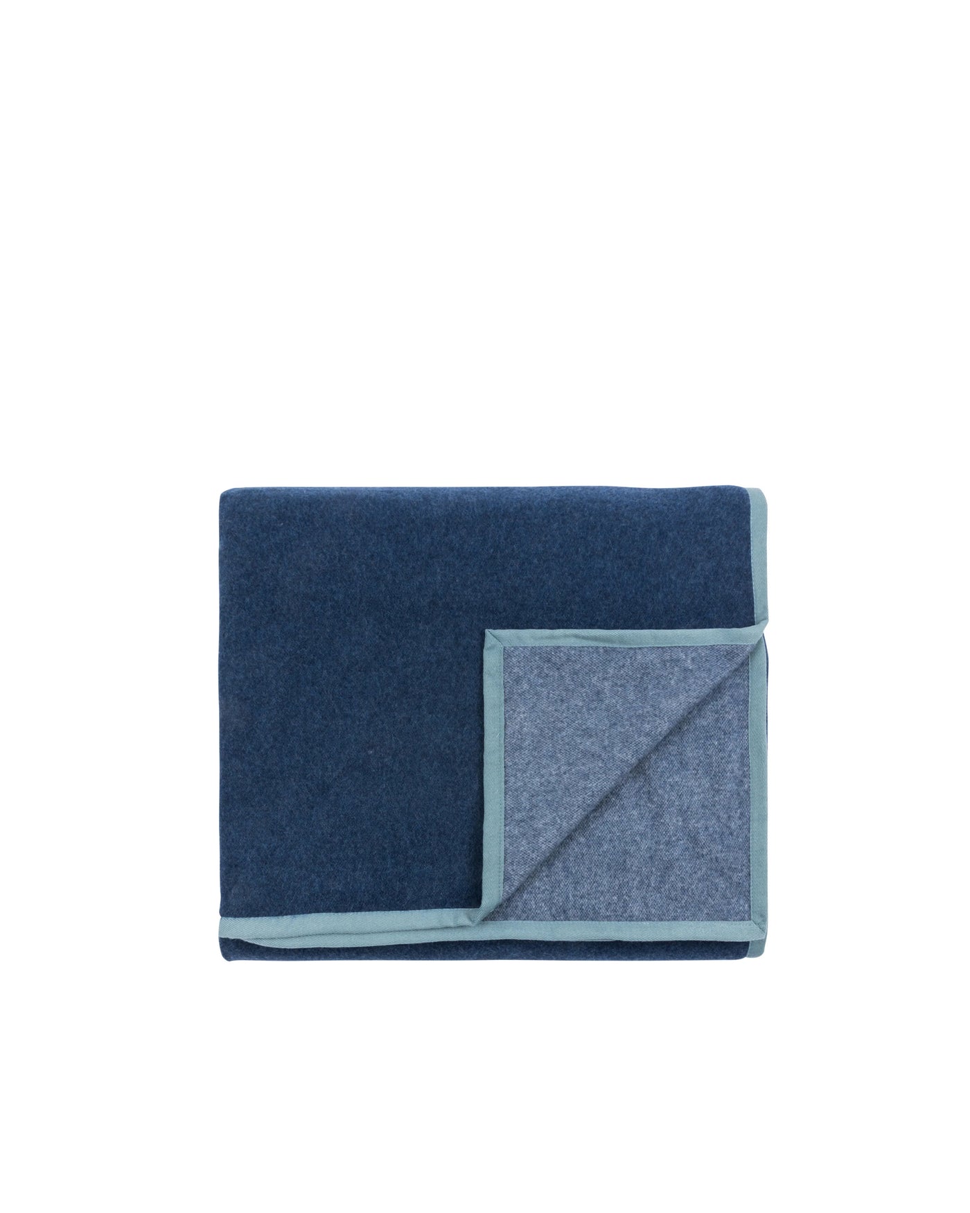 Folded navy wool blanket with contrasting pale blue reverse and trim detail.