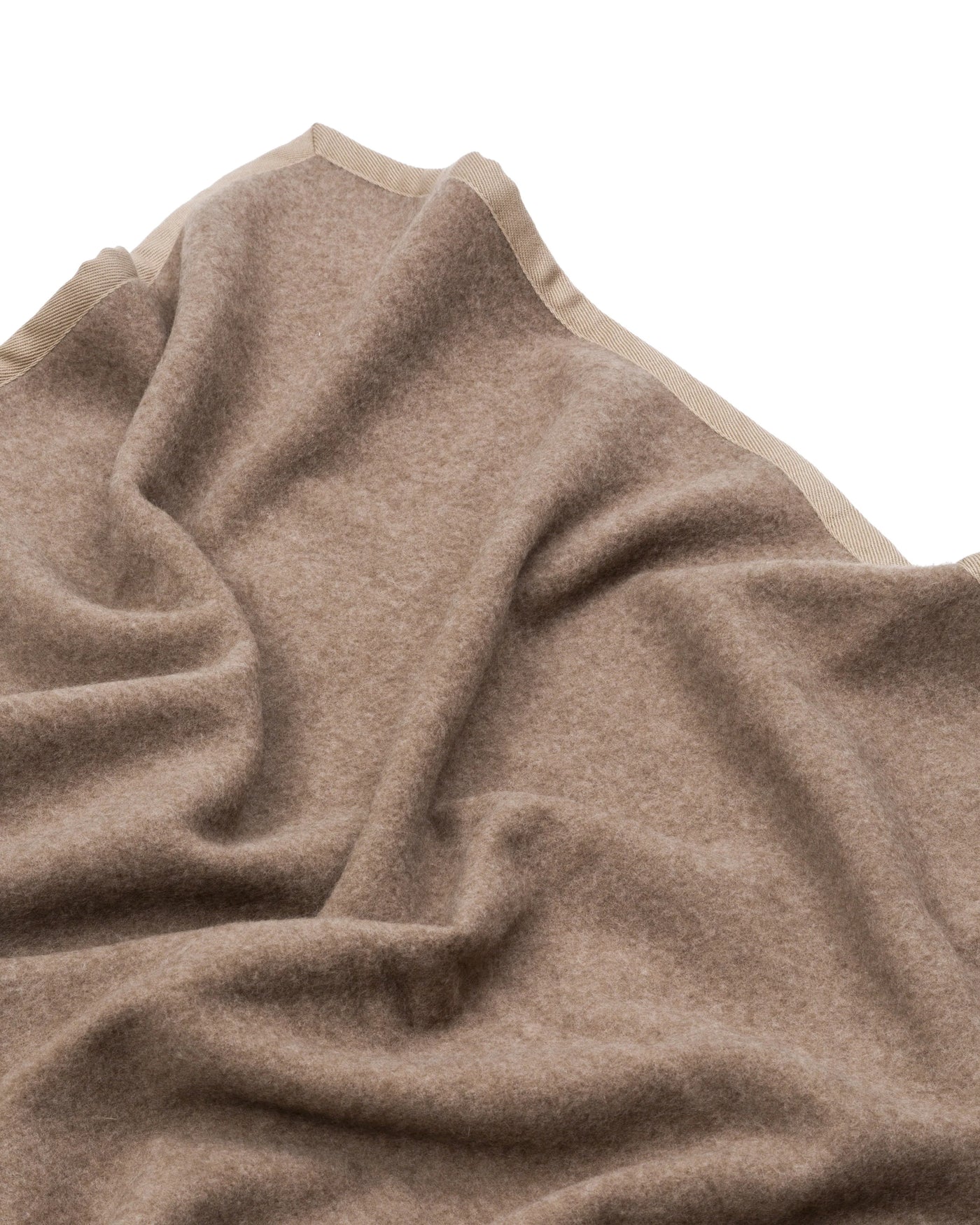 Close-up of Lanerossi Cortina blanket in taupe, showing soft wool texture and contrast border trim.