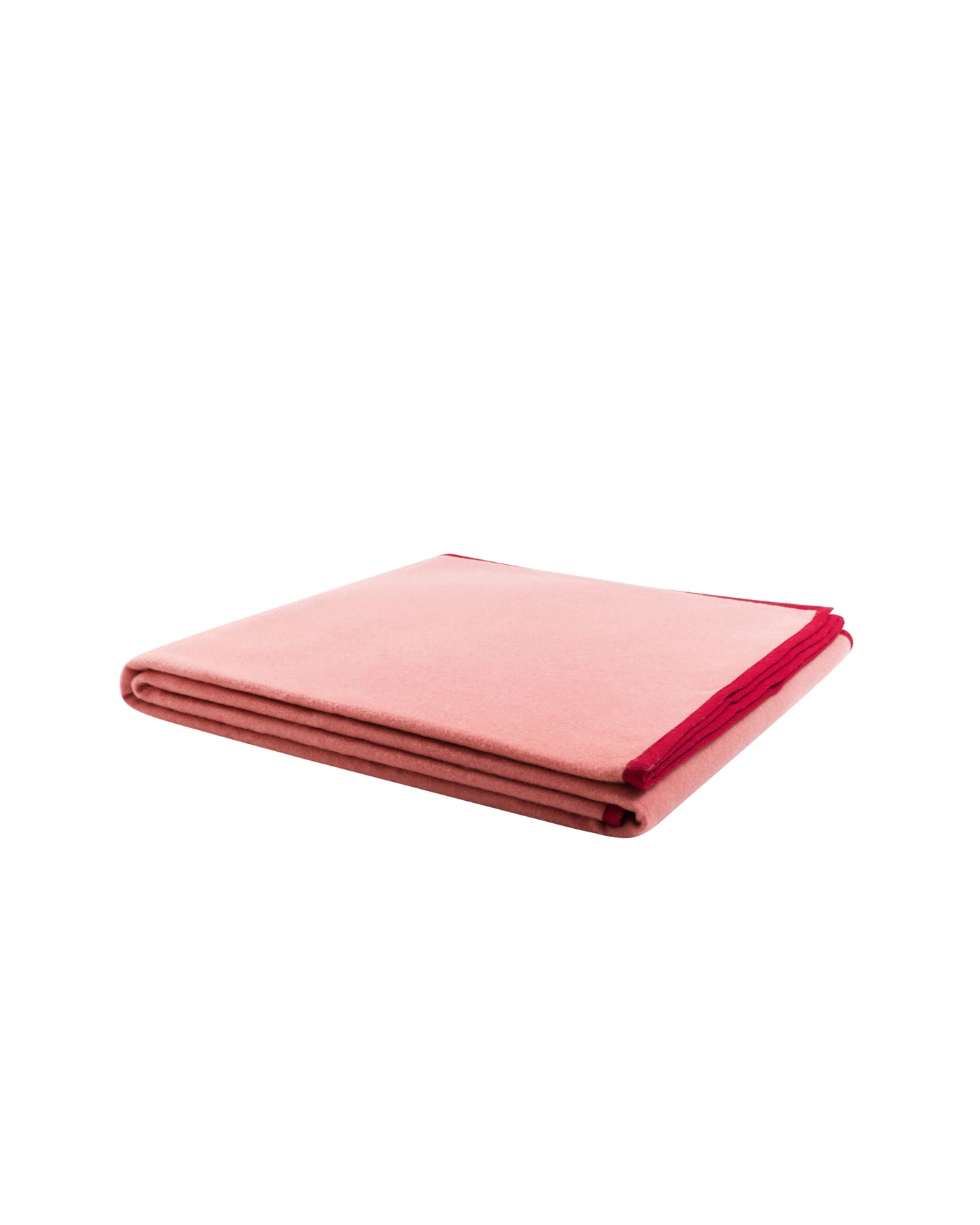 Lanerossi Cortina blanket folded, blush with crimson border trim visible at edge.