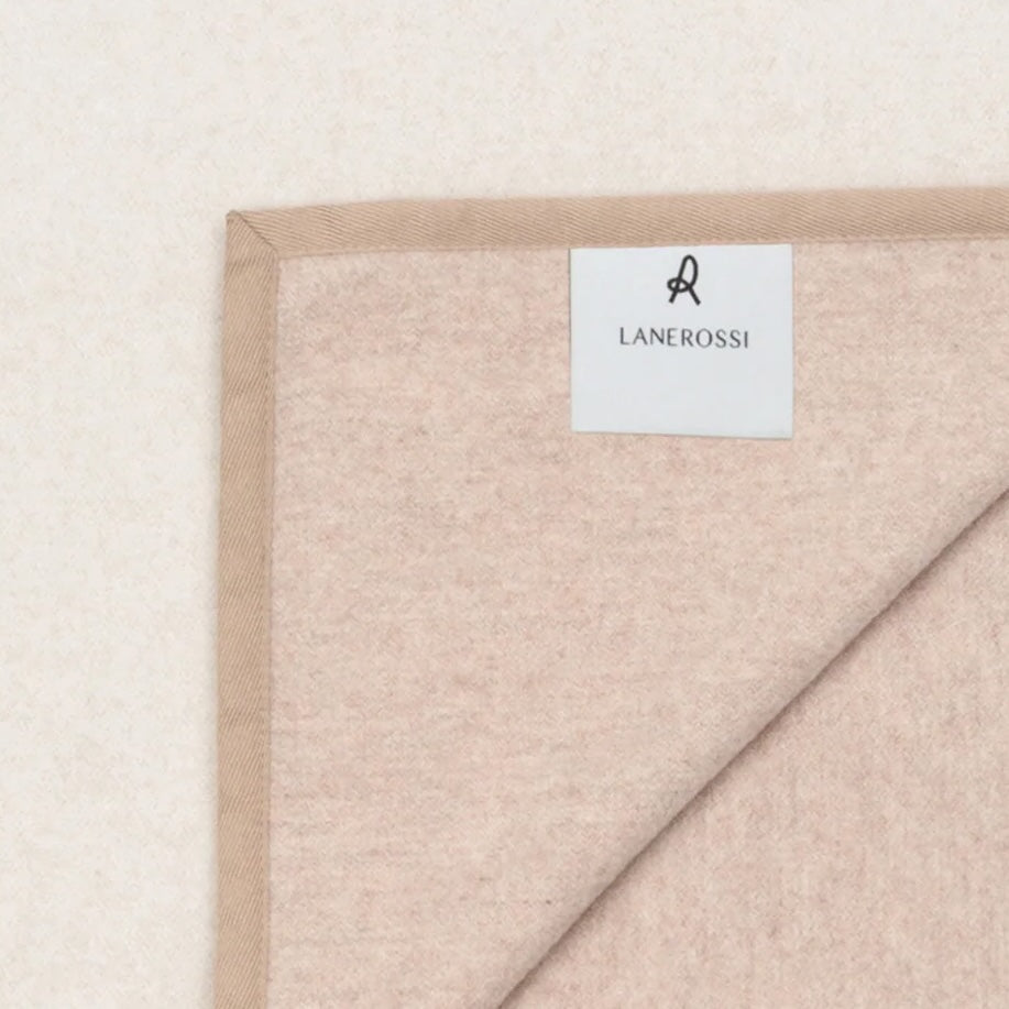 Corner detail of Lanerossi Cortina blanket showing blush wool reverse side and woven label.