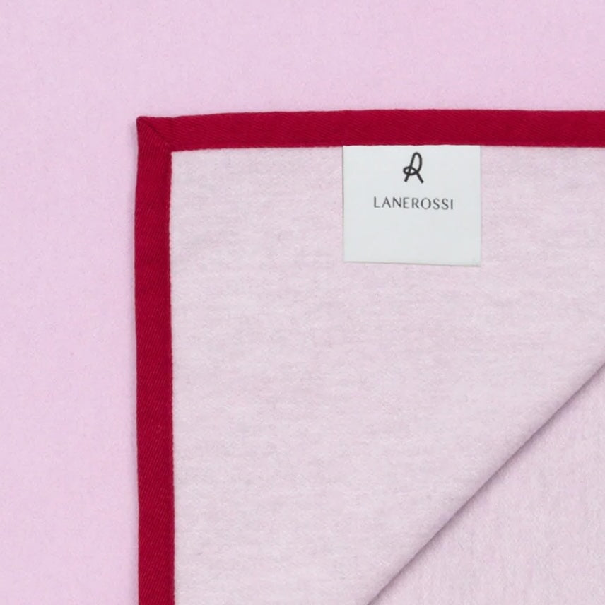 Lanerossi Cortina blanket corner detail showing pink terry fabric and crimson border trim.