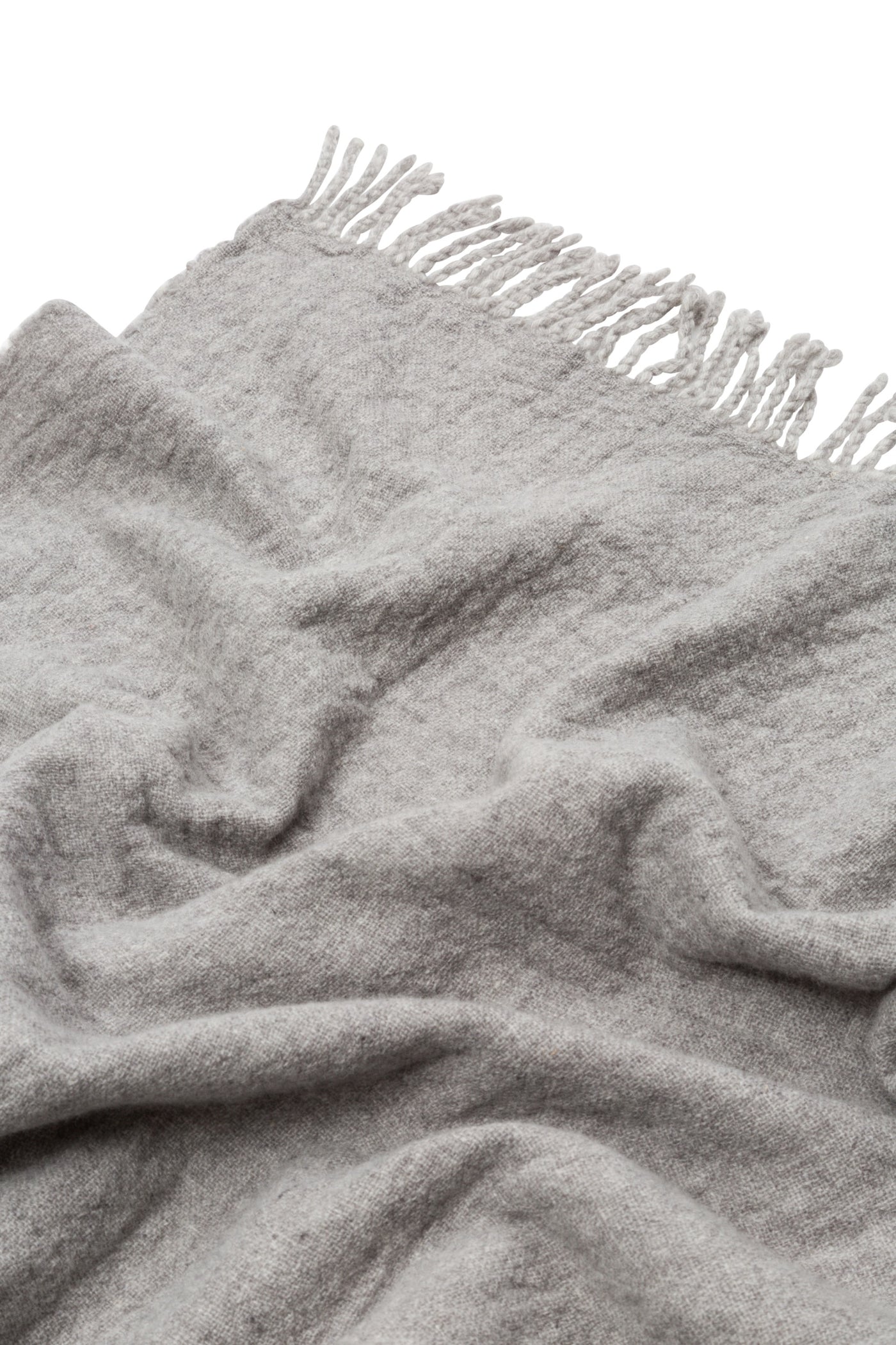 Close-up of Lanerossi Dioniso throw in silver grey, showing brushed wool texture and knotted fringe edge.