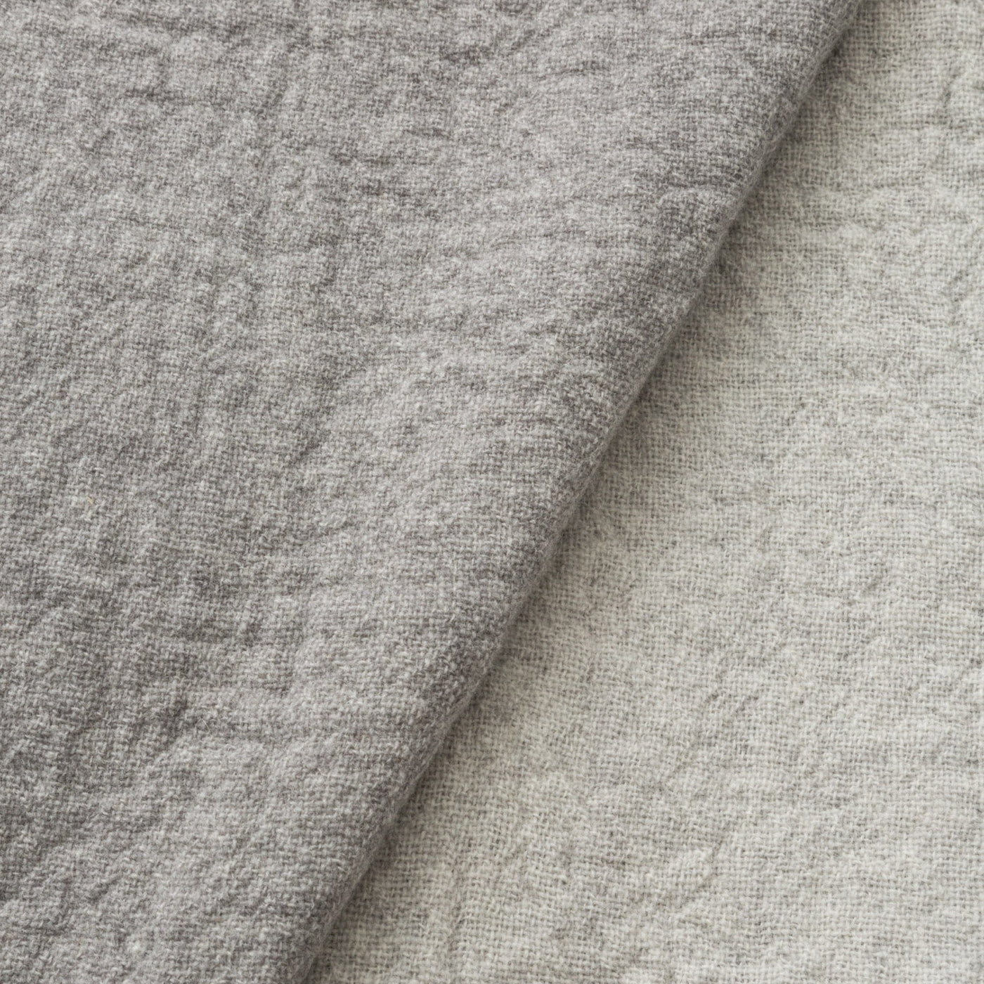 Close-up of folded silver-grey Lanerossi Dioniso throw showing textured chenille weave surface.