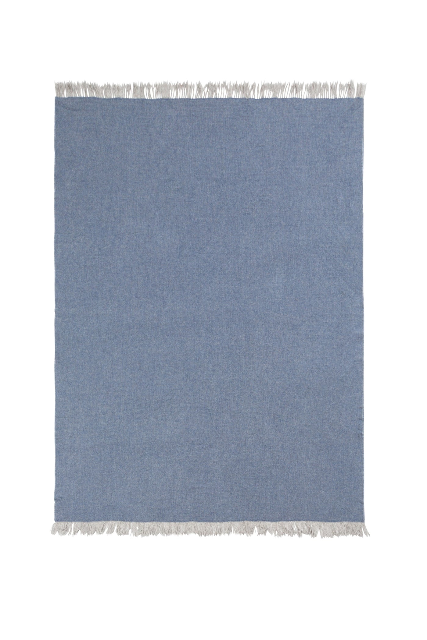 Slate blue Dioniso throw laid flat, ivory fringe trim along top and bottom edges.