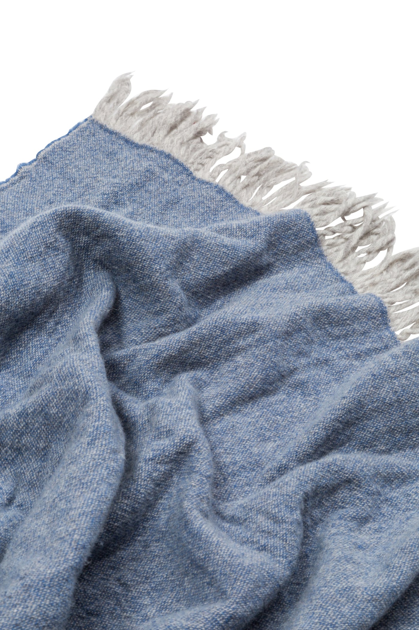 Close-up of Lanerossi Dioniso throw in blue with grey fringe trim detail.