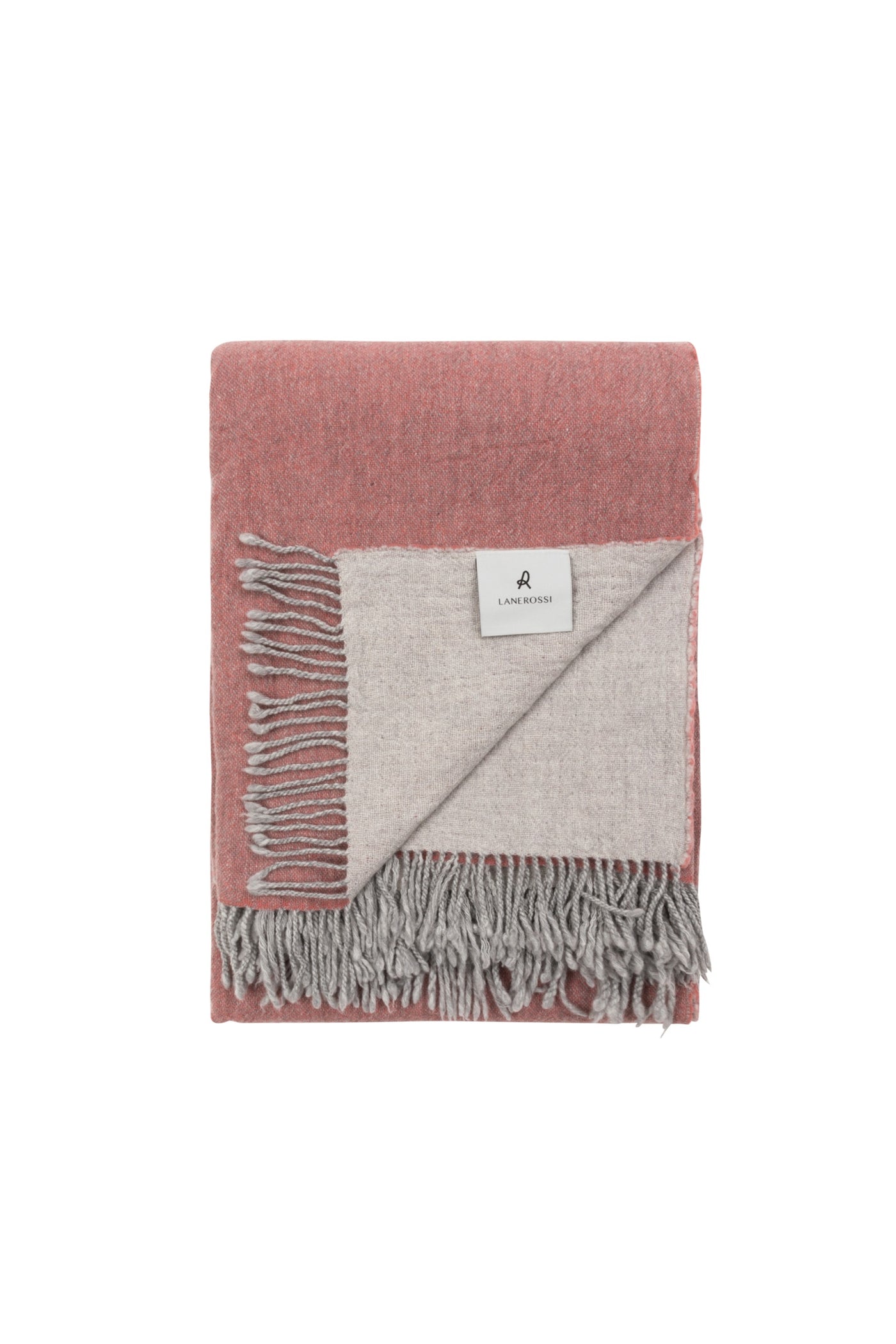 Lanerossi Dioniso throw folded, showing blush and silver-grey reversible sides with fringe trim.
