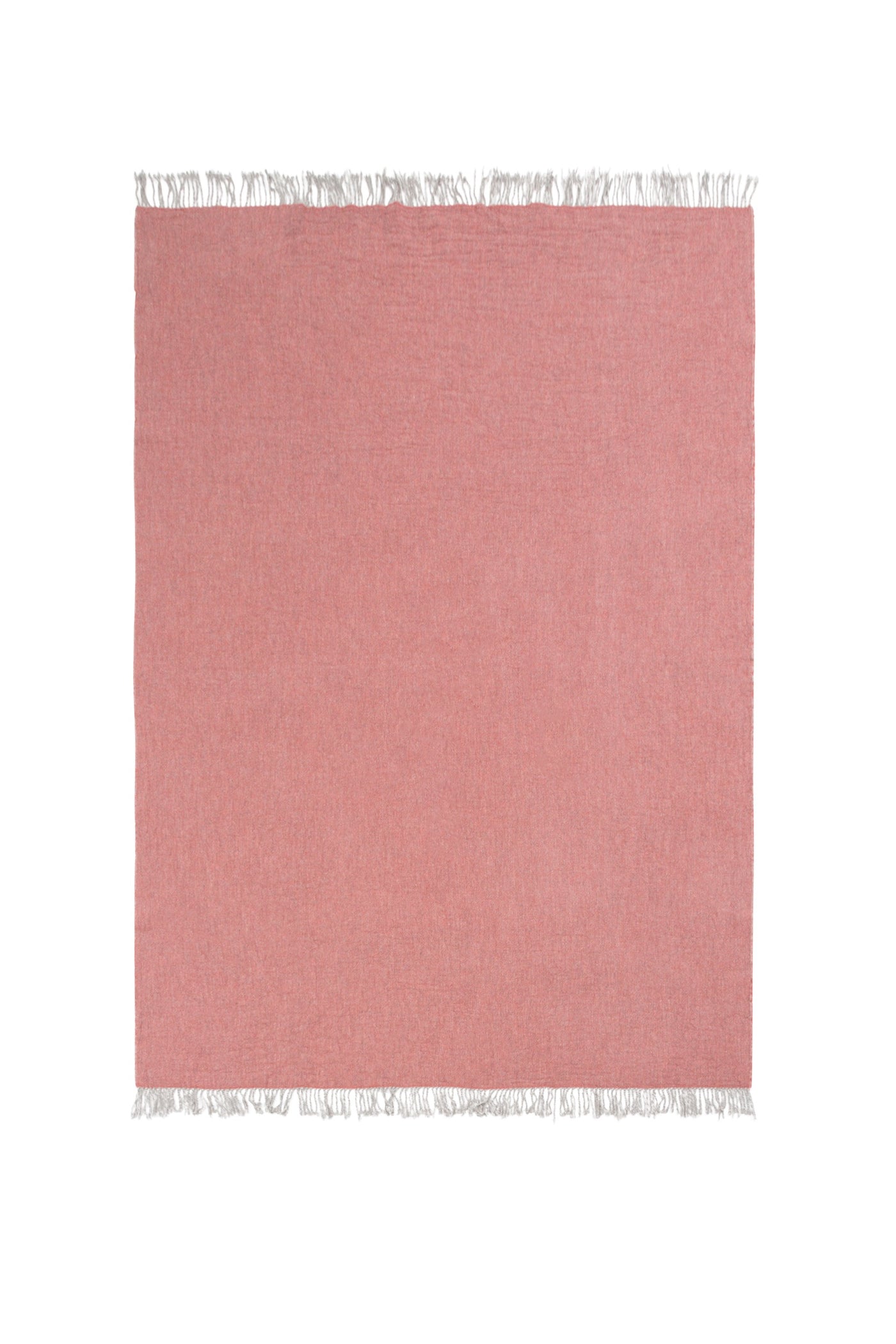 Blush pink woven throw laid flat, with white fringe trim along top and bottom edges.