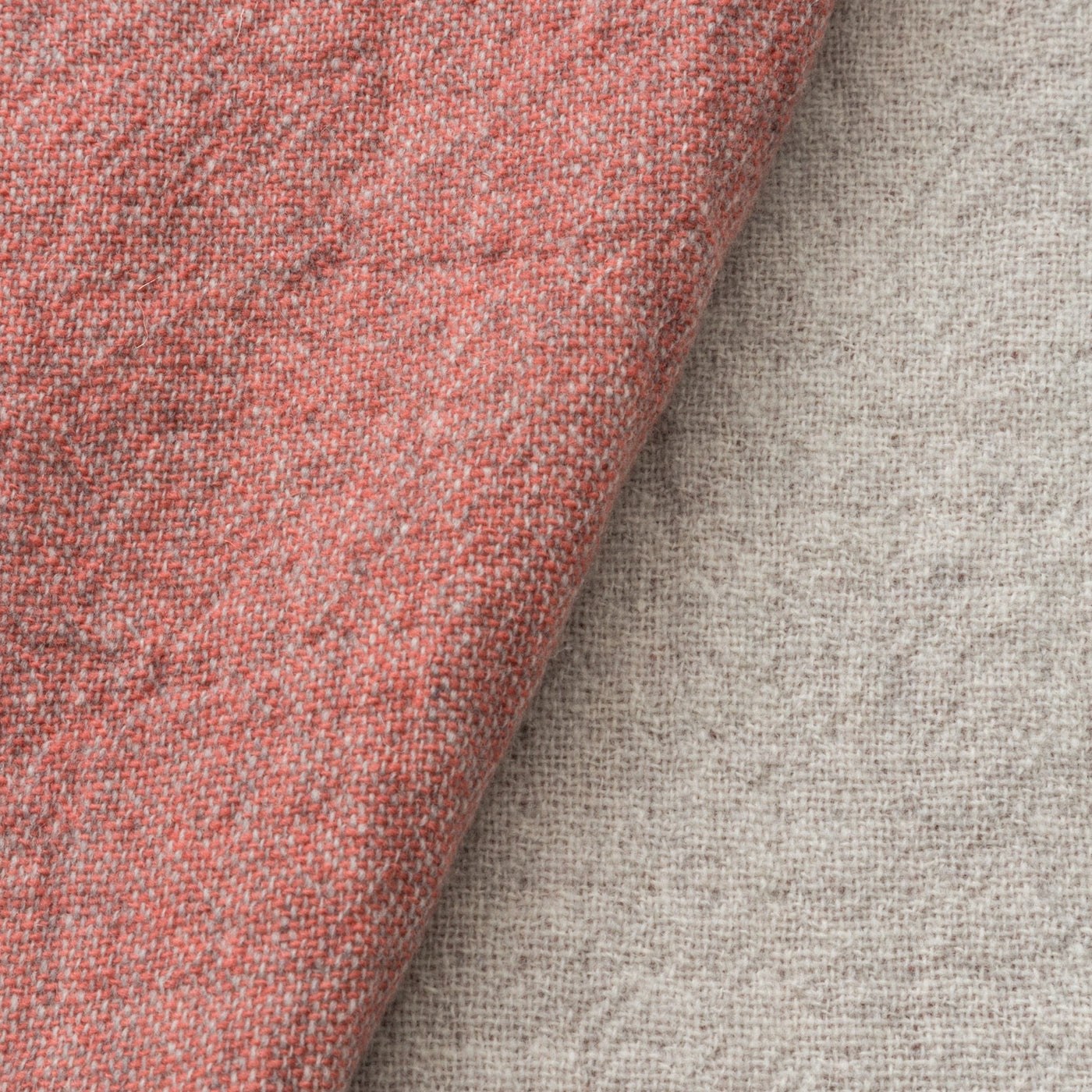 Close-up of Lanerossi Dioniso throw in terracotta, showing heathered wool weave texture.