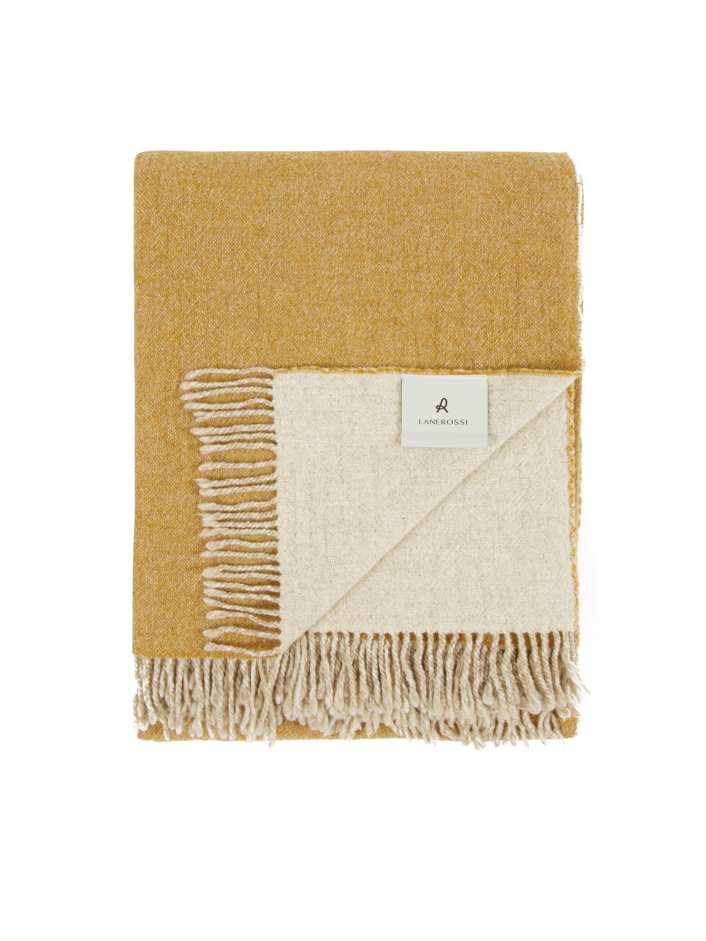 Lanerossi Dioniso throw folded, showing mustard and ivory reversible sides with fringe trim.