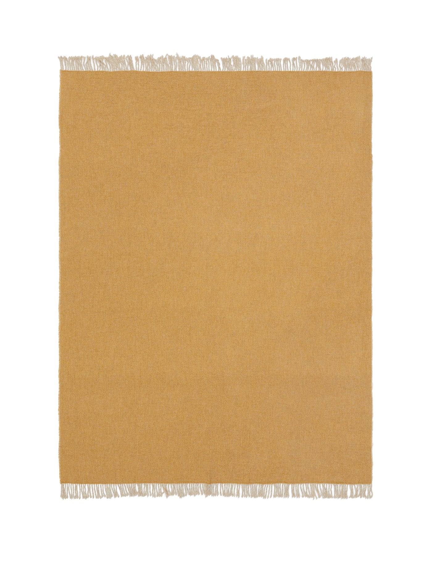 Honey-toned woven throw with contrast ivory fringe trim, flat lay view.