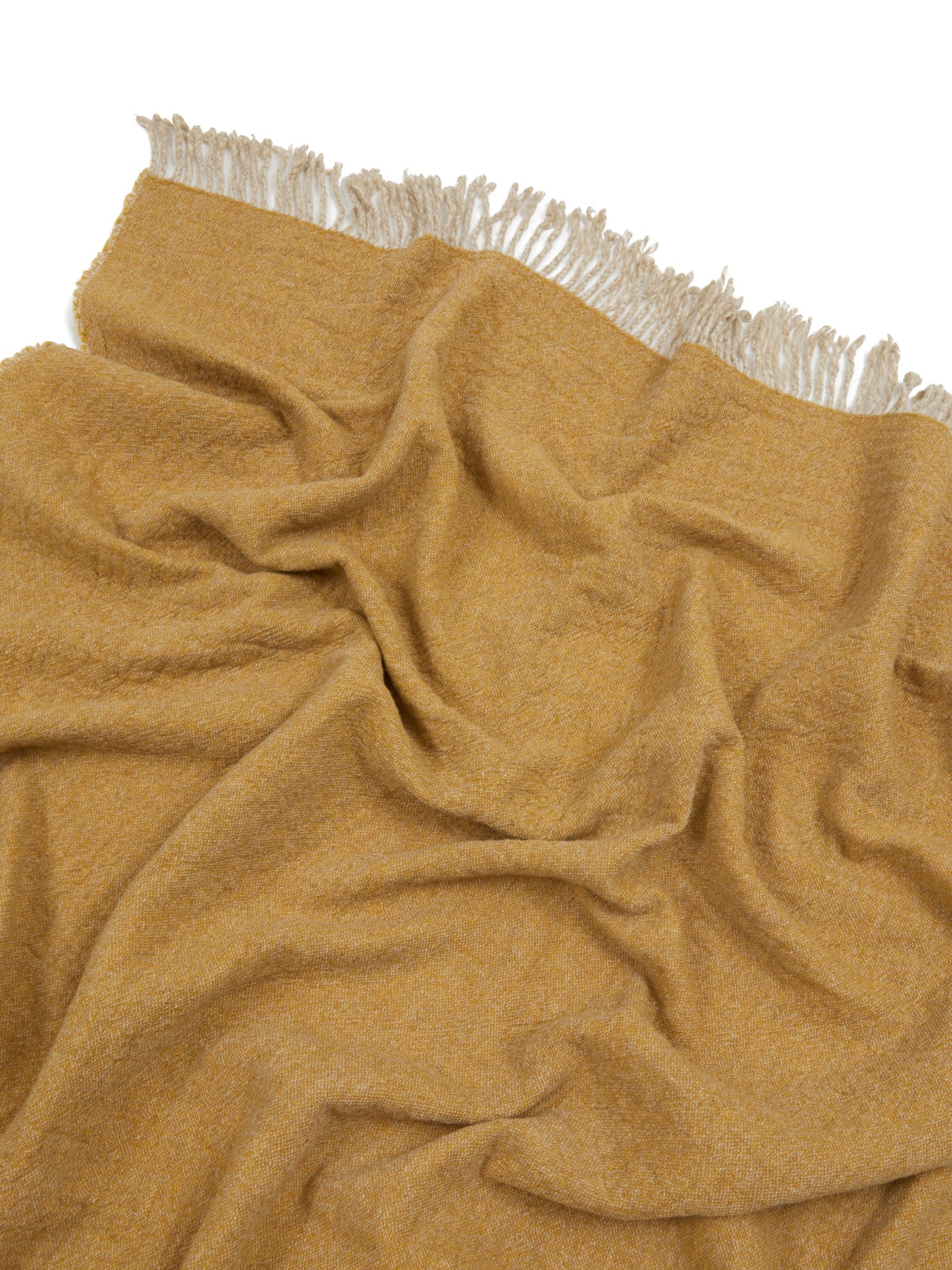 Close-up of Lanerossi Dioniso throw in amber, showing textured weave and ivory fringe trim.