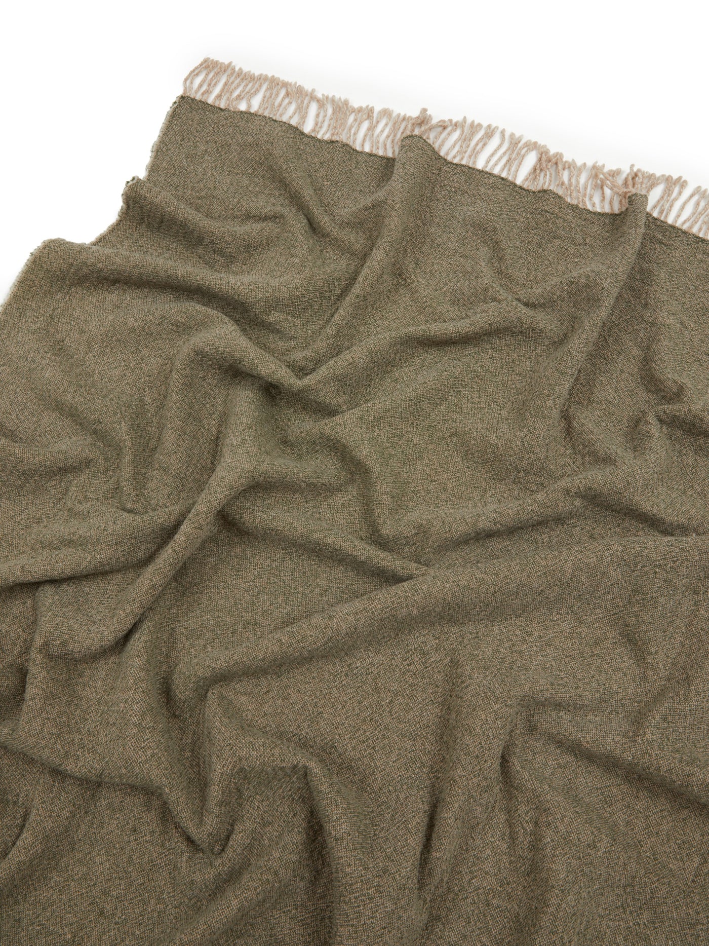 Olive green Lanerossi Dioniso throw draped loosely, showing fringe trim detail along top edge.