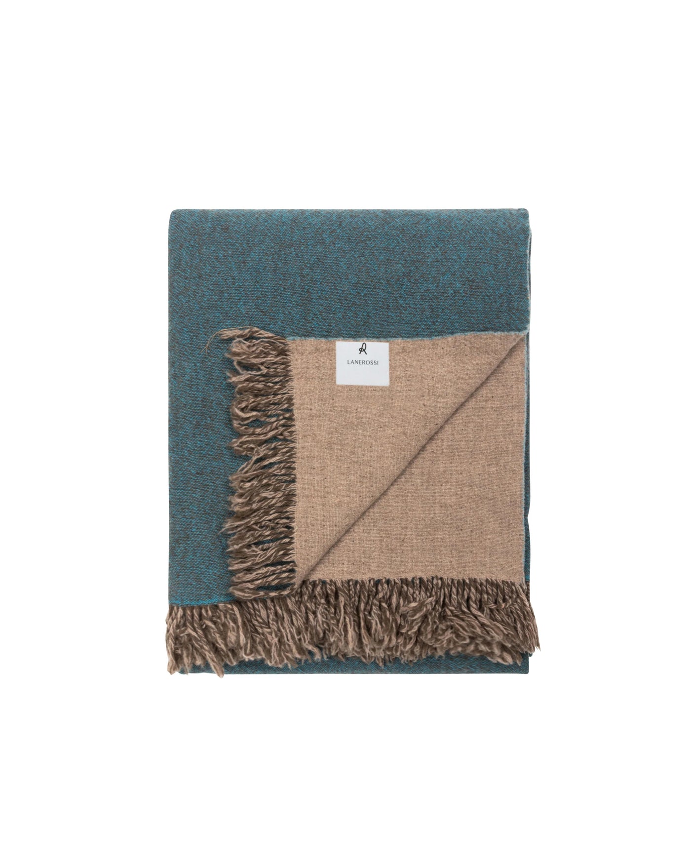 Folded teal herringbone throw with sand reverse and fringe trim, corner turned to show contrast lining.