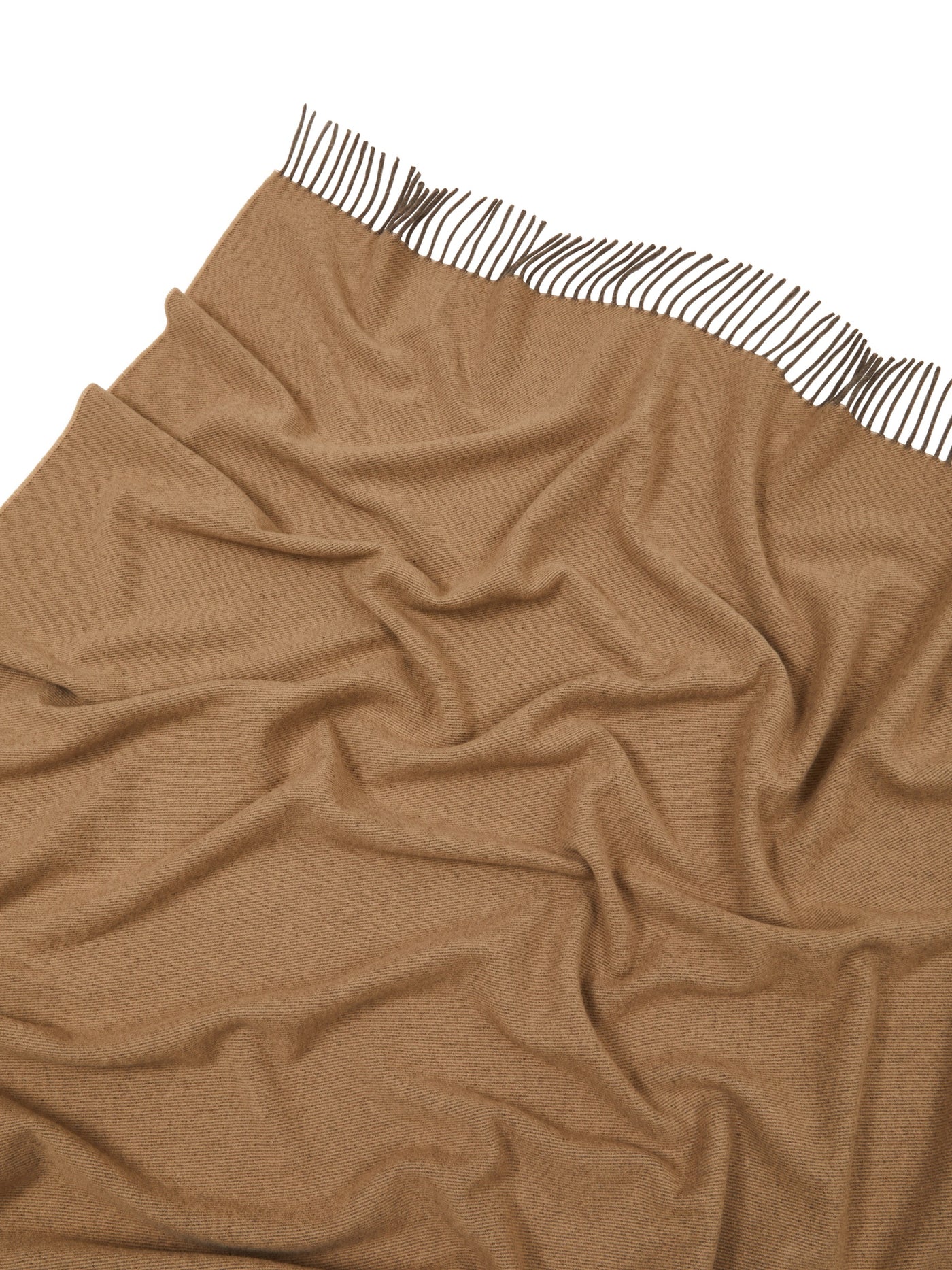 Close-up of camel throw's fringed edge with brown-and-white striped trim detail.
