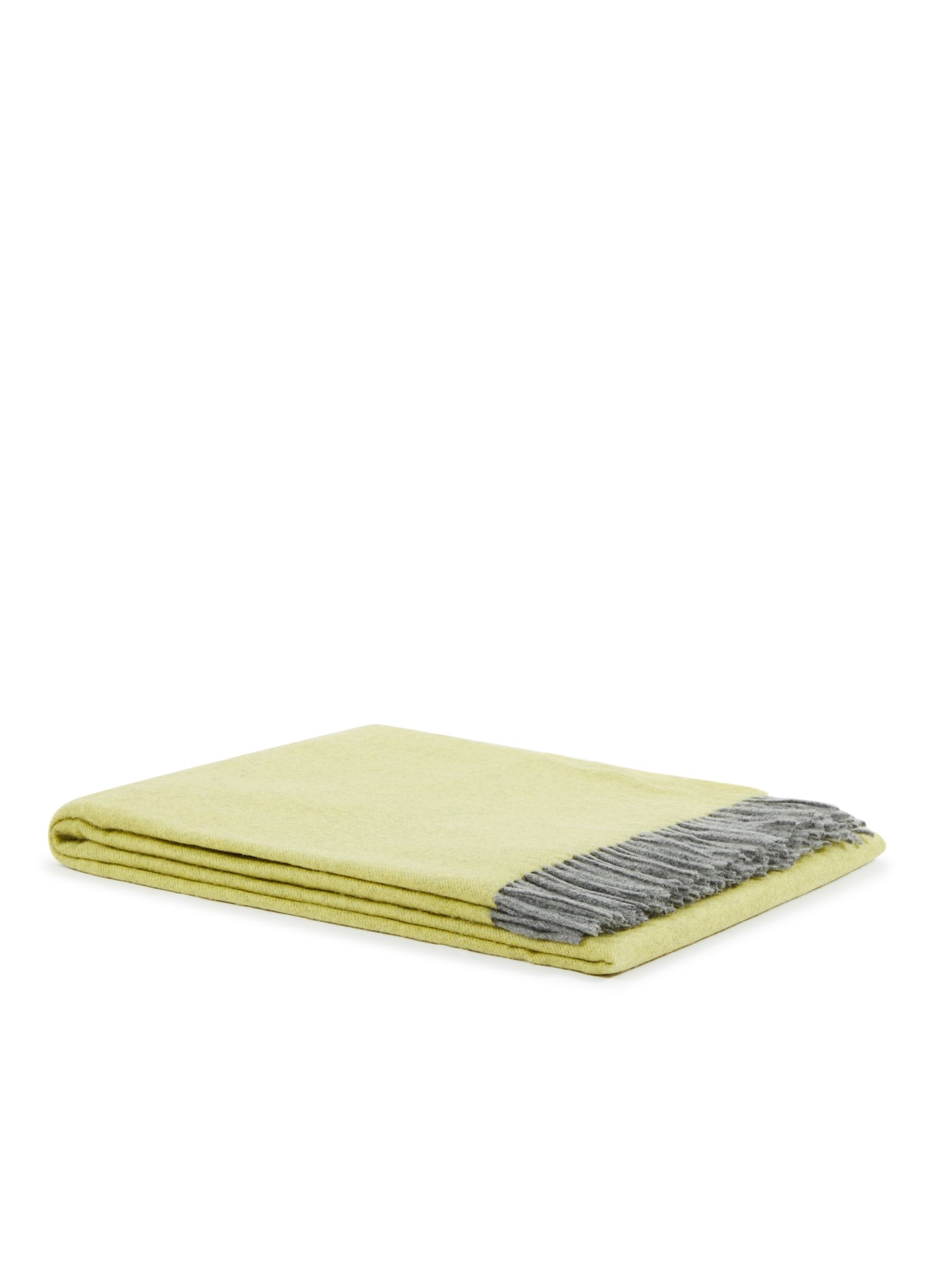 Citron throw folded neatly, showing grey fringe trim along one edge.