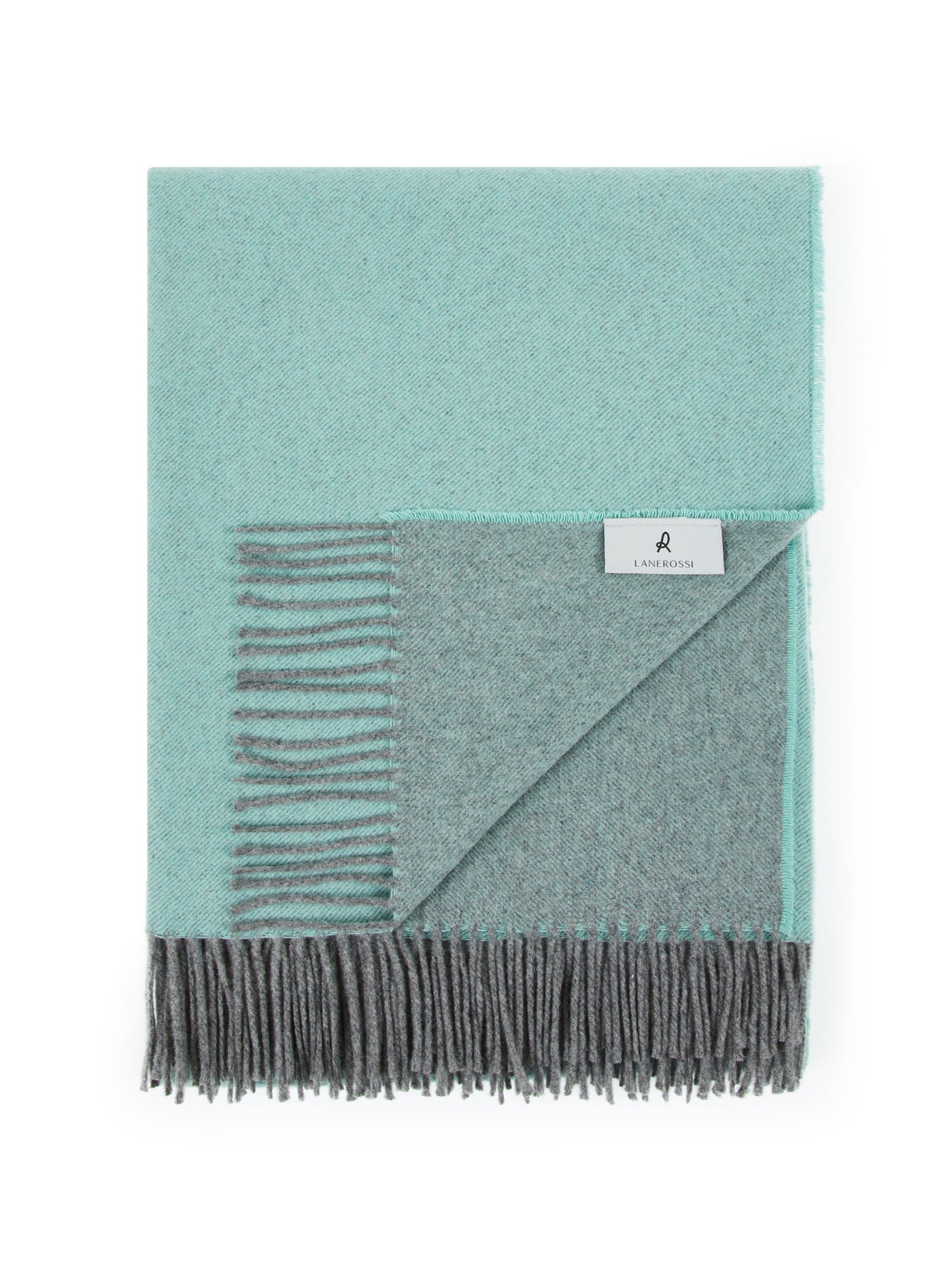 Folded reversible throw with aqua and charcoal grey sides, fringe edge, Lanerossi label visible.