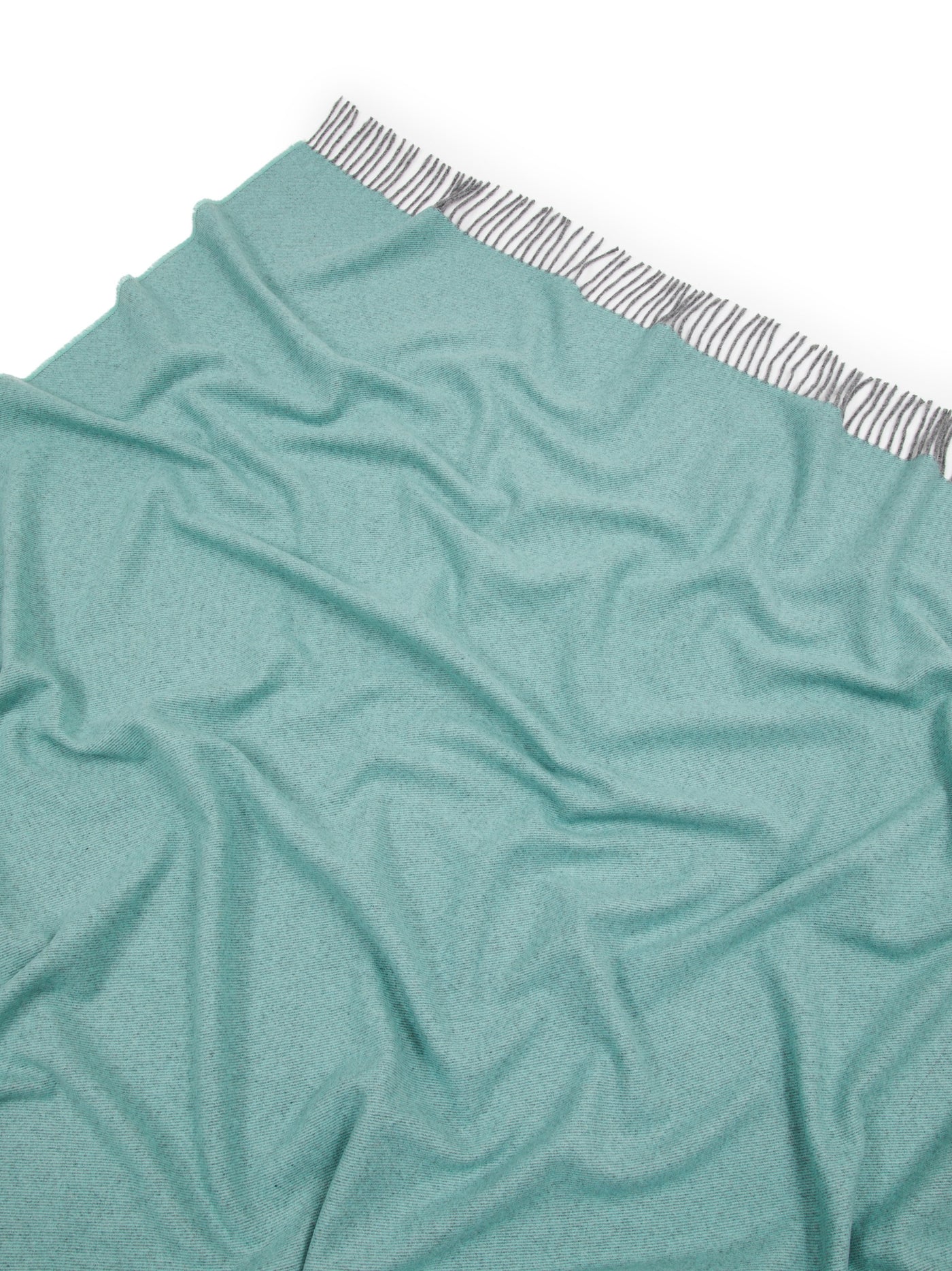 Close-up of Lanerossi Everest Colour throw in teal, striped grey trim visible at top edge.